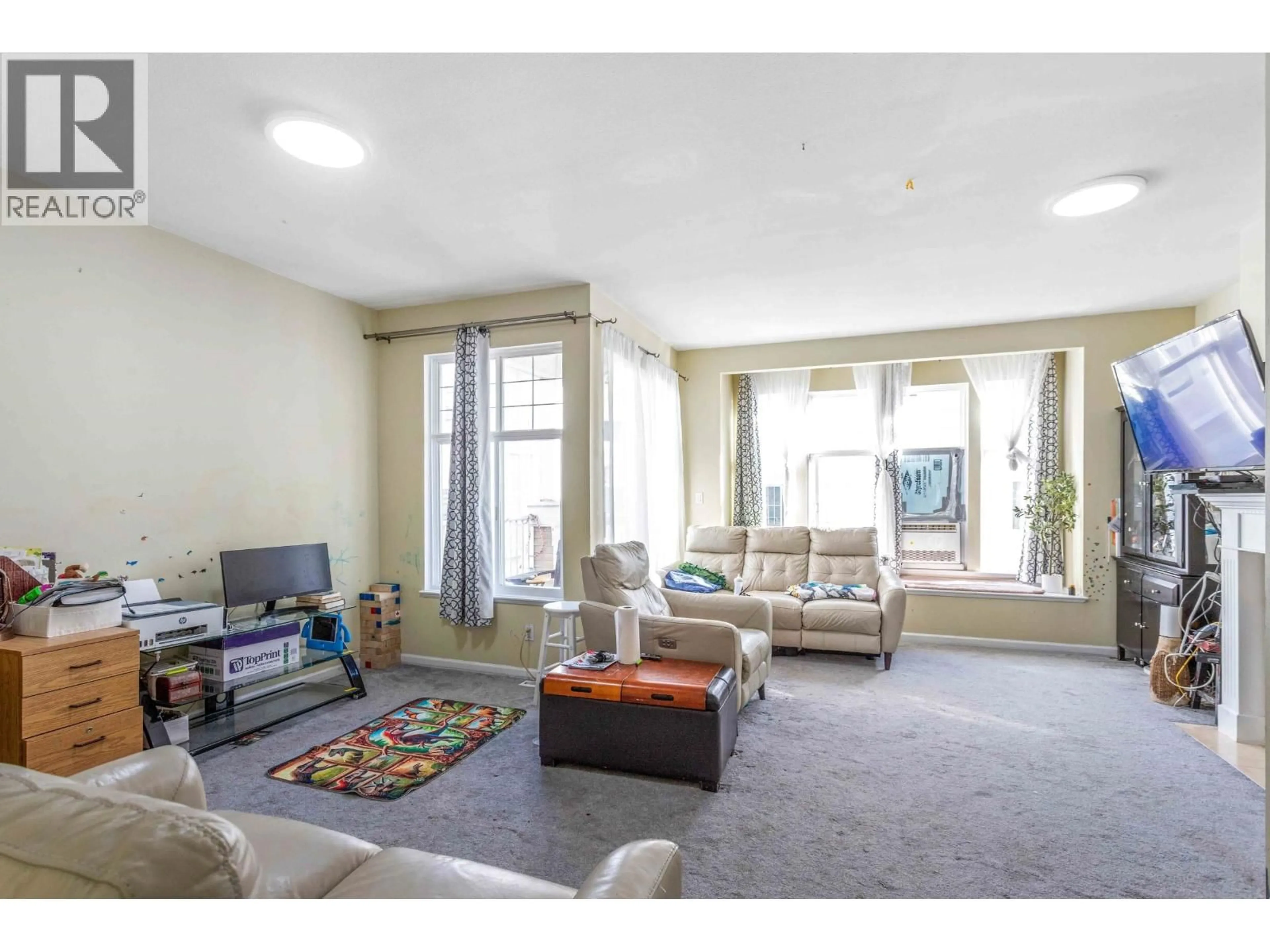Living room with furniture, carpet floor for 83 - 22888 WINDSOR COURT, Richmond British Columbia V6V2W6
