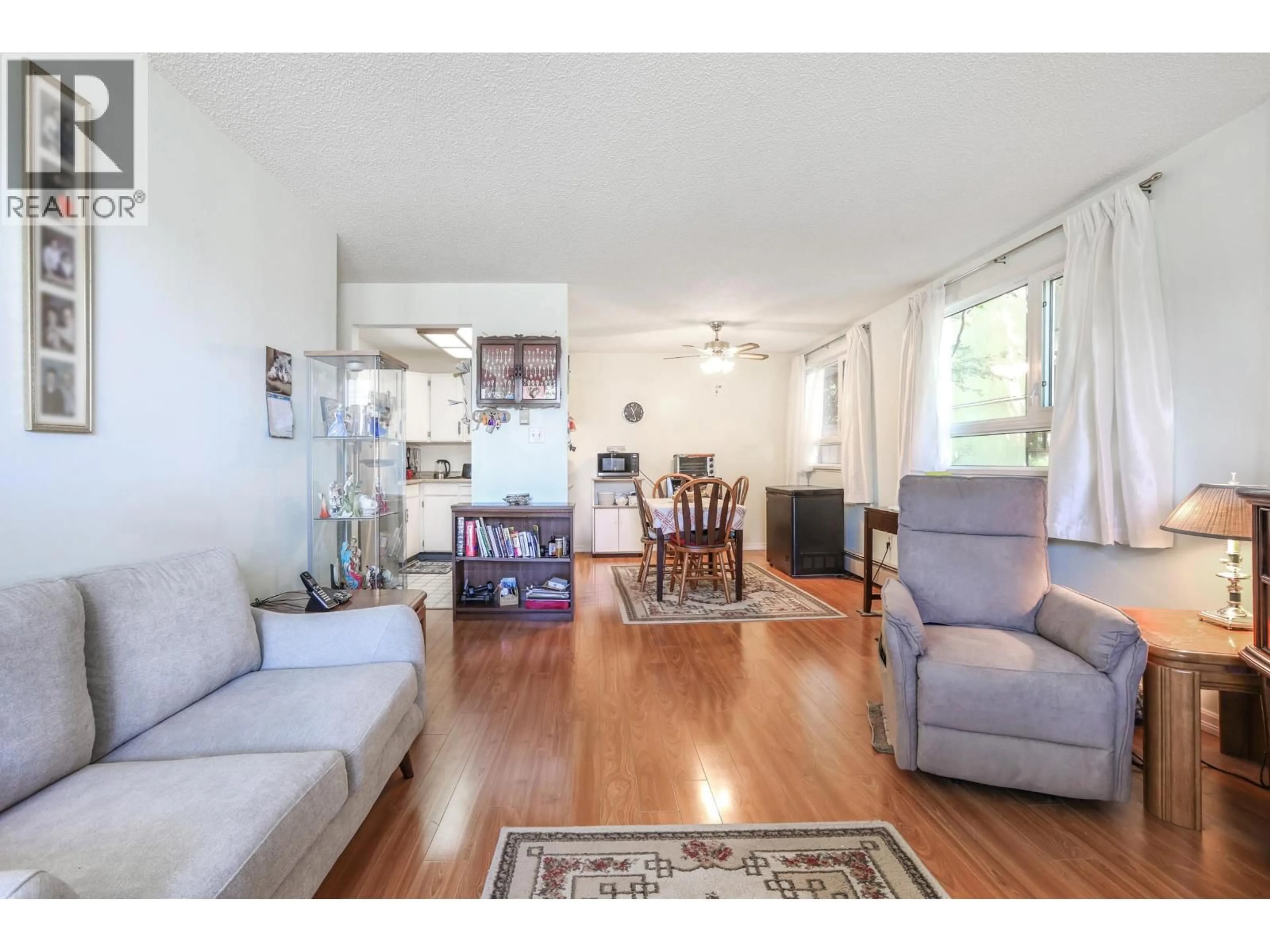 Living room with furniture, wood/laminate floor for 205 - 665 6TH AVENUE, Vancouver British Columbia V5T4J3