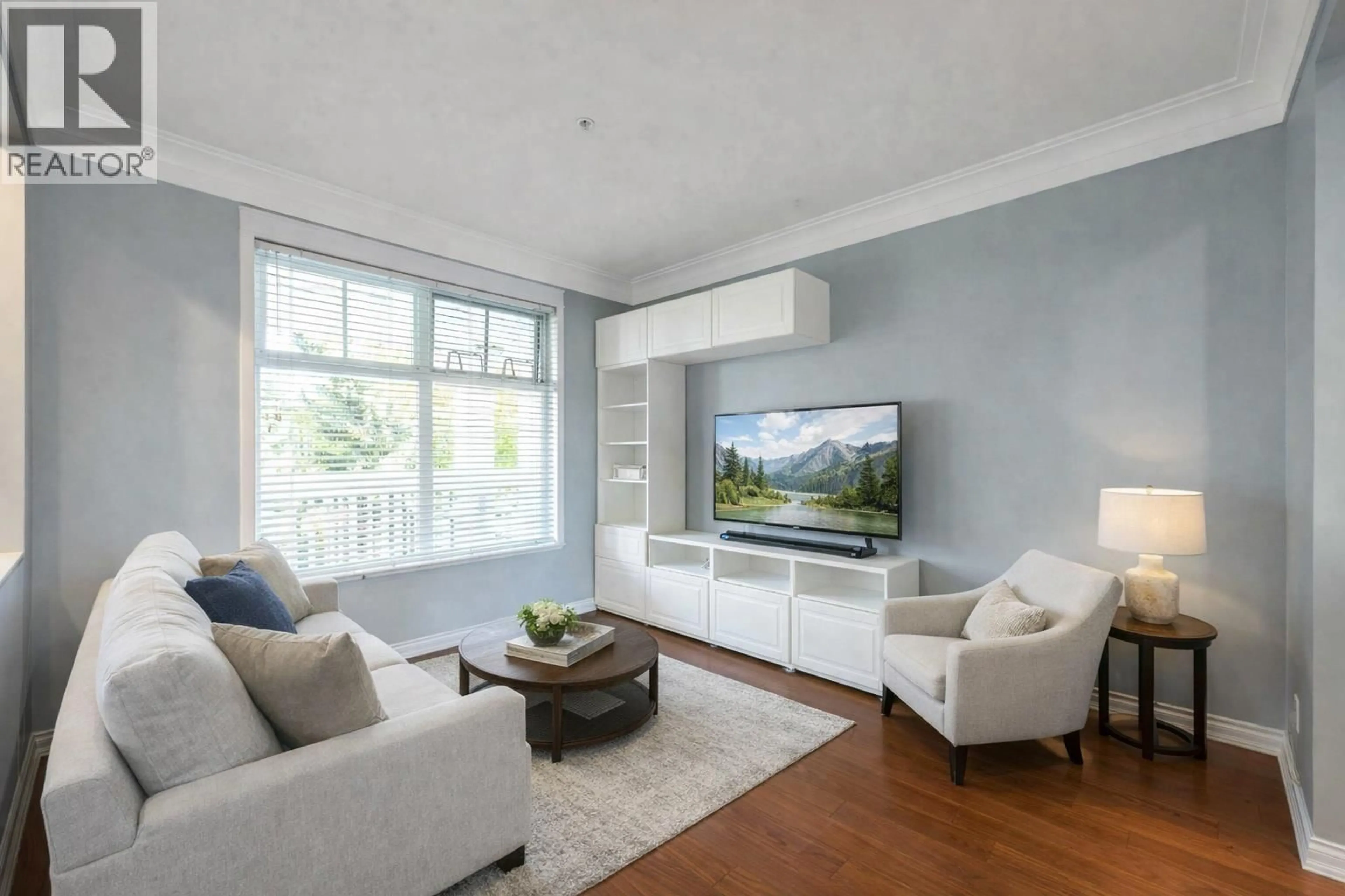 Living room with furniture, wood/laminate floor for 213 - 6263 RIVER ROAD, Delta British Columbia V4K5E3