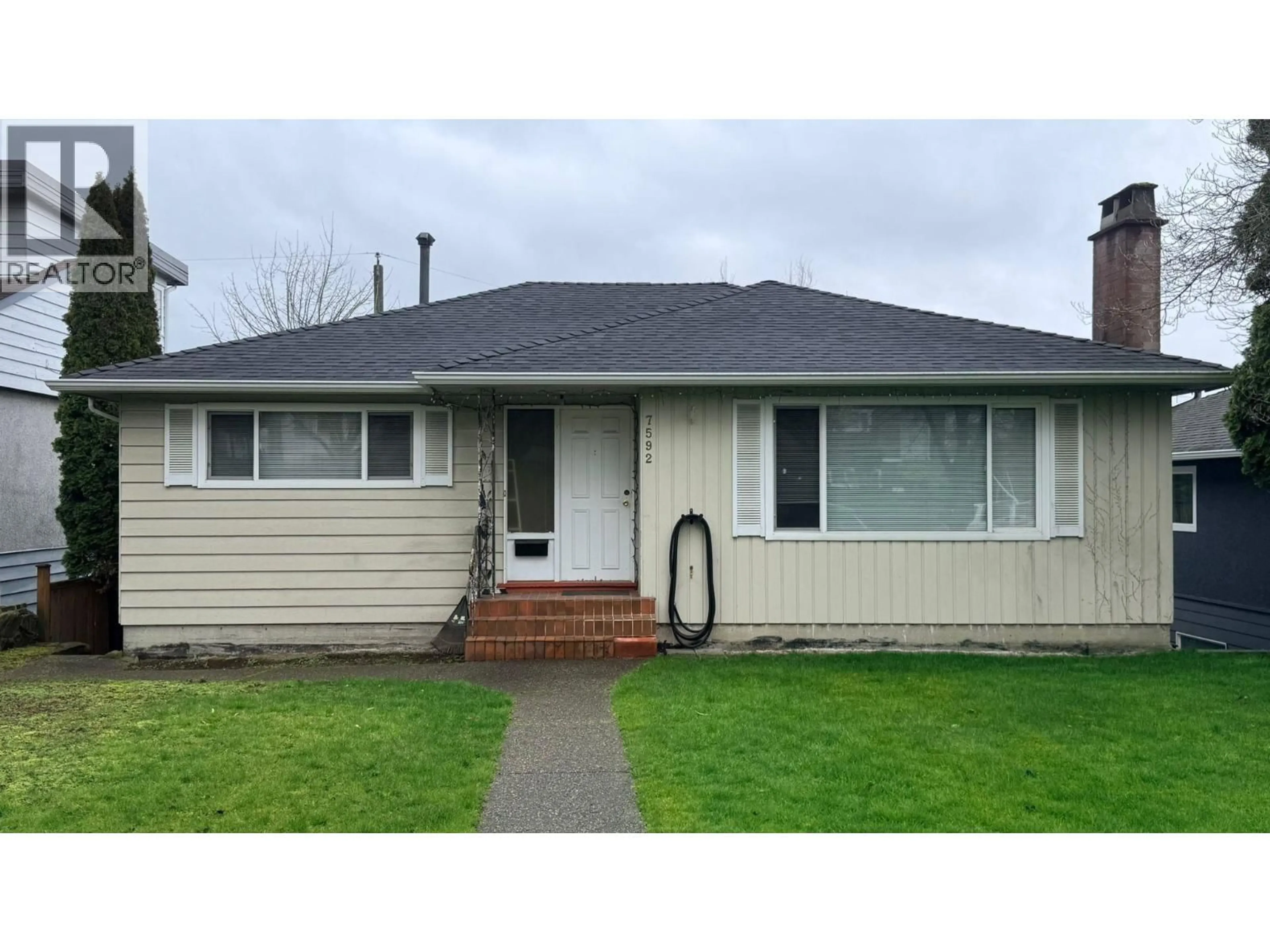 Home with vinyl exterior material, street for 7592 ELLIOTT STREET, Vancouver British Columbia V5S2N6