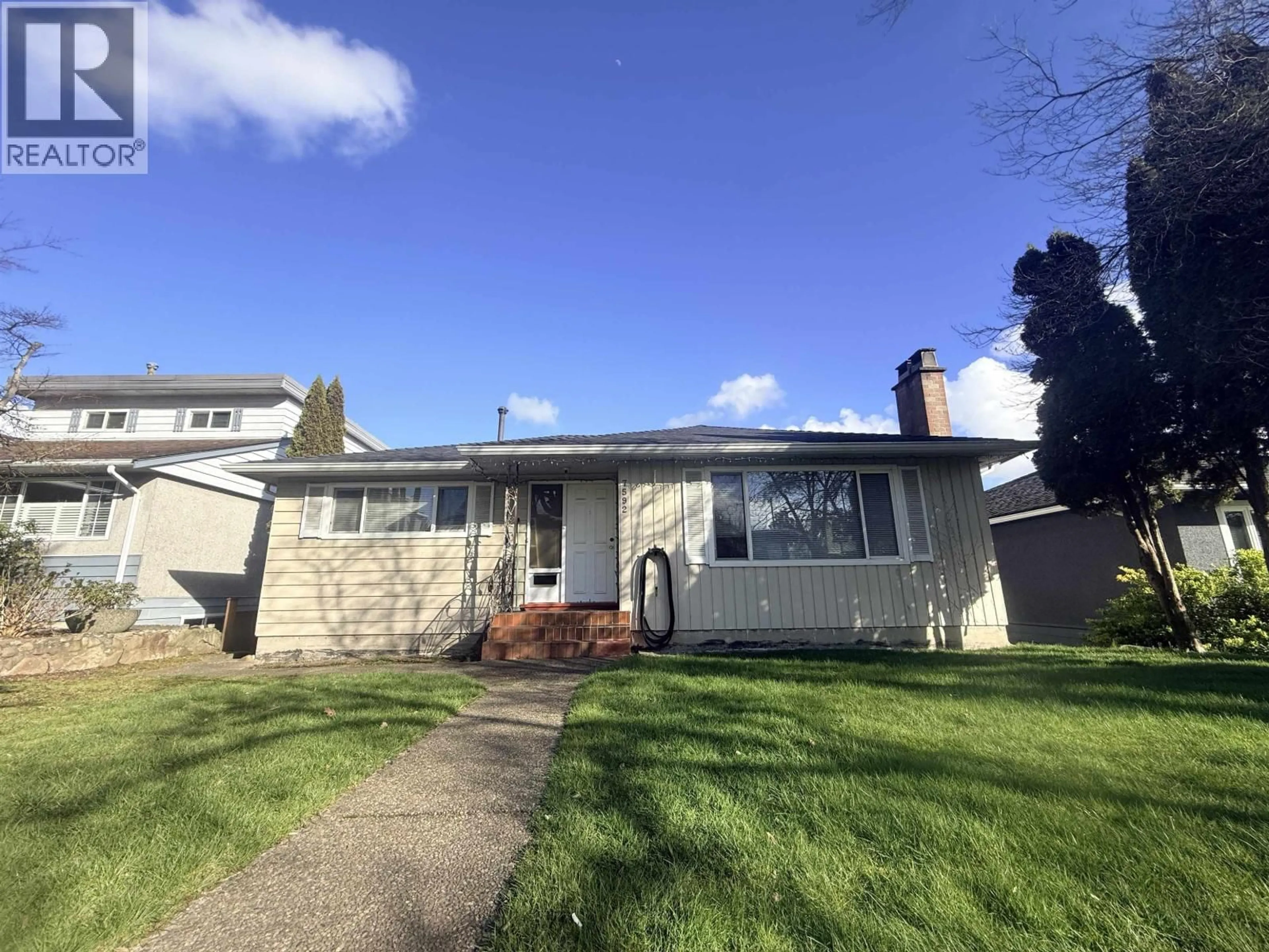 Home with vinyl exterior material, street for 7592 ELLIOTT STREET, Vancouver British Columbia V5S2N6