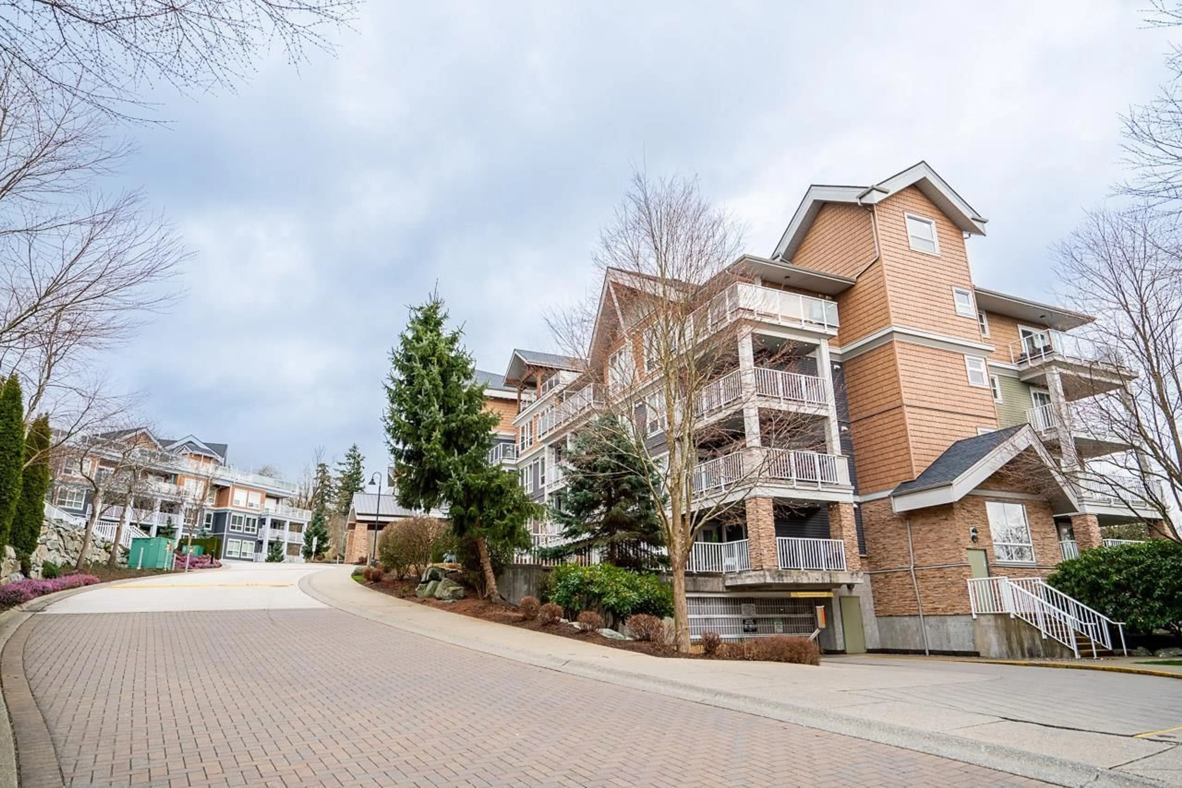 A pic from outside/outdoor area/front of a property/back of a property/a pic from drone, street for 311 - 6460 194 STREET, Surrey British Columbia V4N6J8