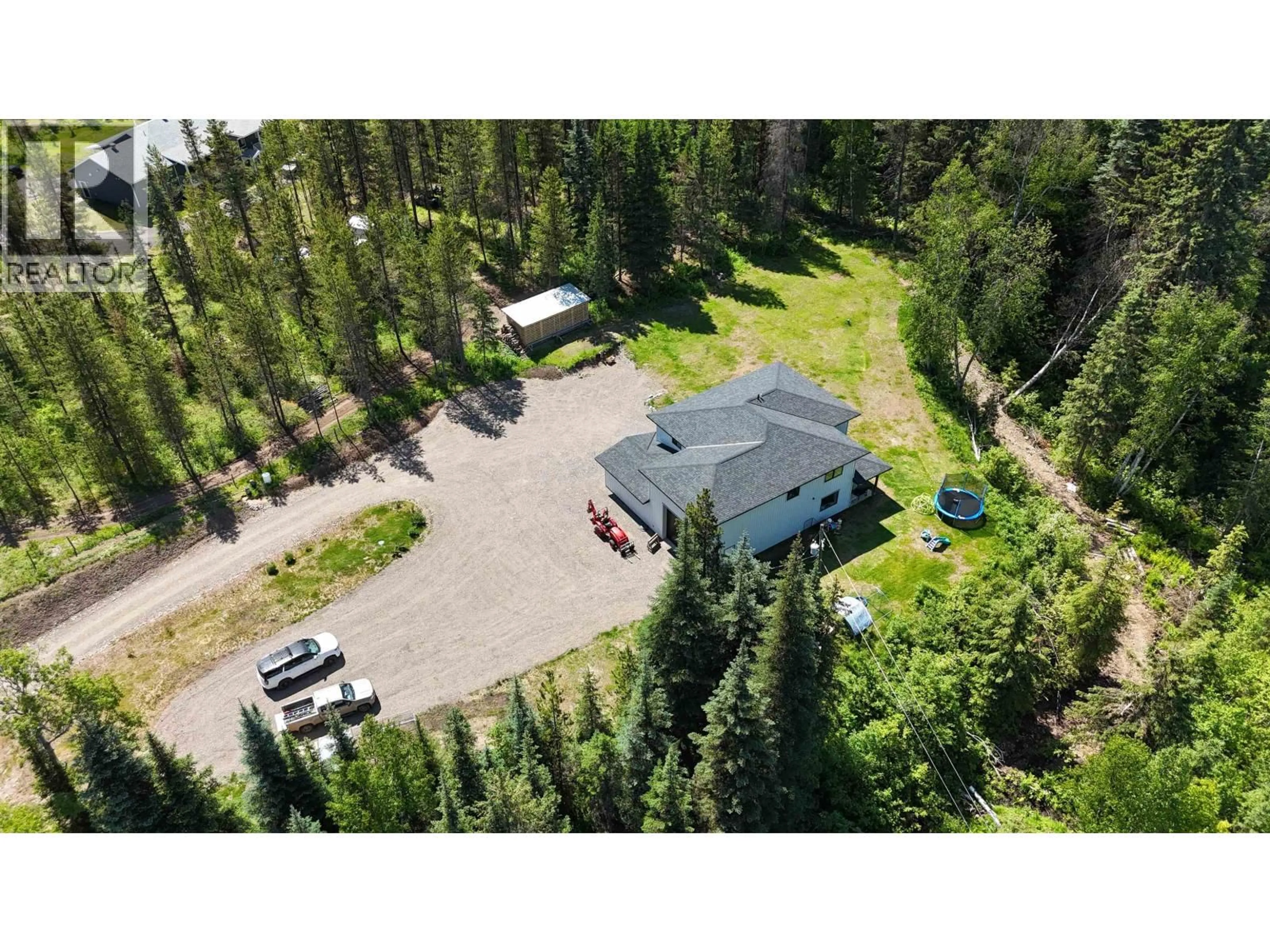 A pic from outside/outdoor area/front of a property/back of a property/a pic from drone, forest/trees view for 24151 RIVER ROAD, Smithers British Columbia V0J2N1
