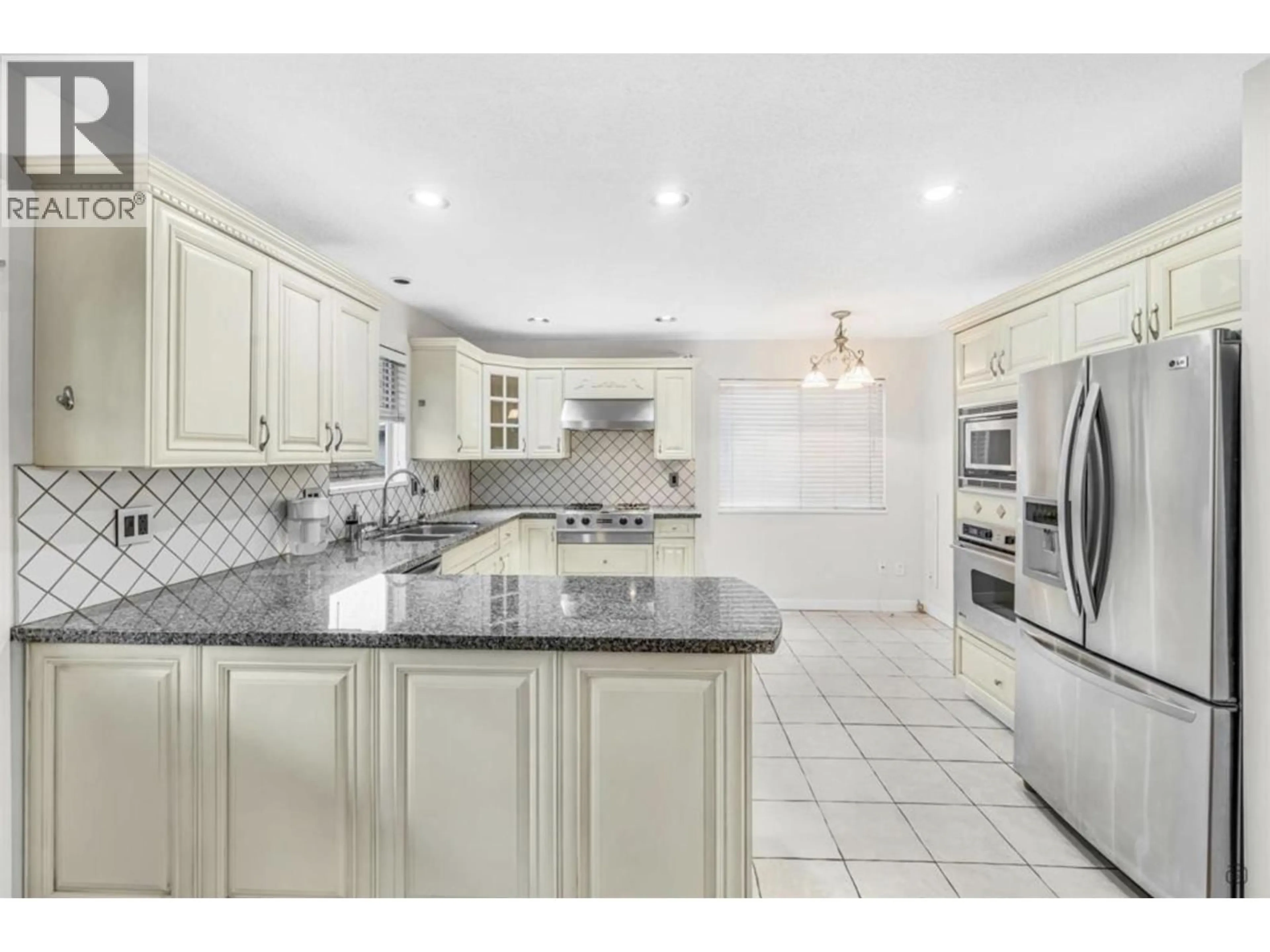 Open concept kitchen, ceramic/tile floor for 7996 PRINCE EDWARD STREET, Vancouver British Columbia V5X3R6