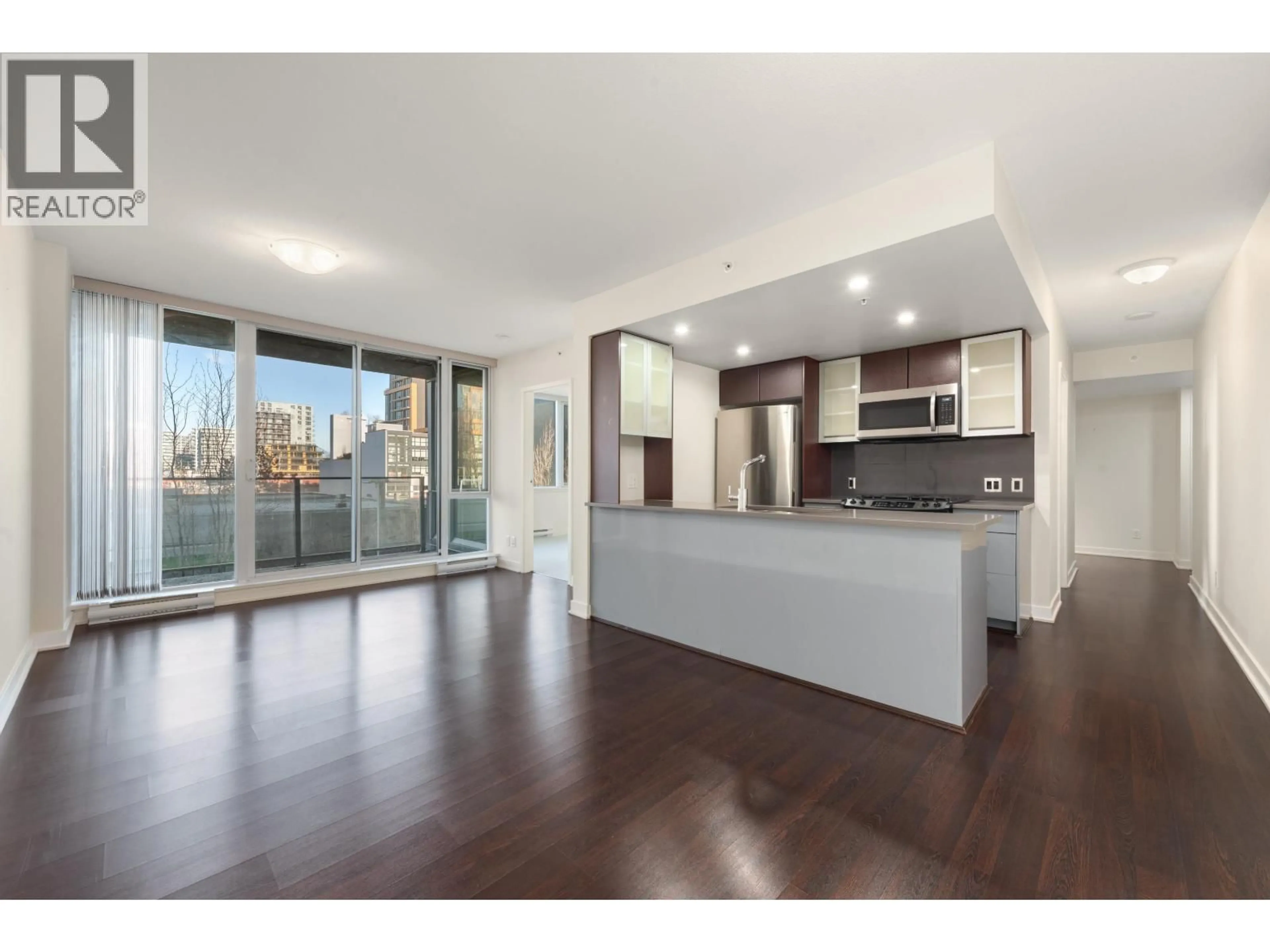 Open concept kitchen, wood/laminate floor for 302 - 7080 NO. 3 ROAD, Richmond British Columbia V6Y0B5