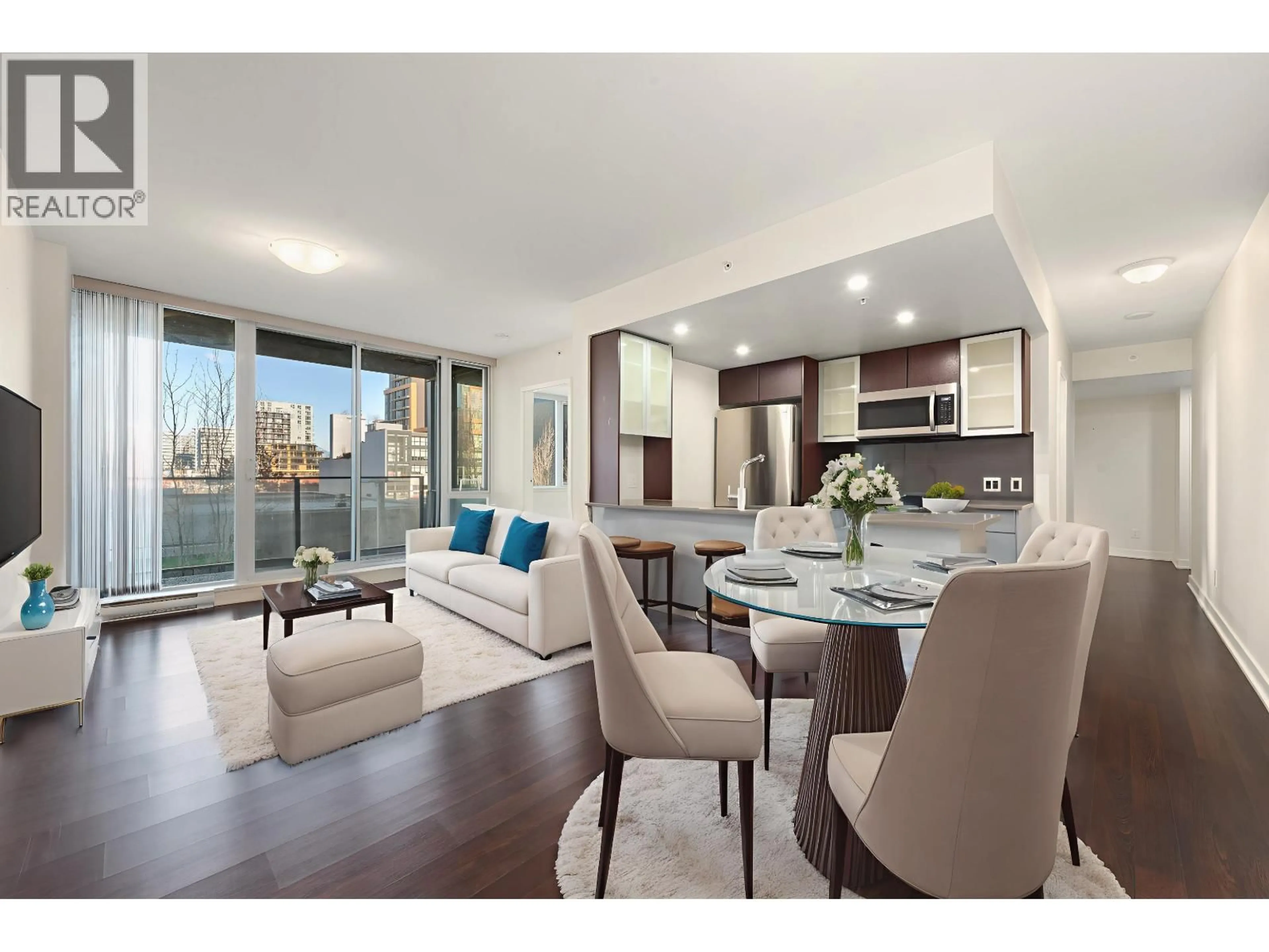 Living room with furniture, wood/laminate floor for 302 - 7080 NO. 3 ROAD, Richmond British Columbia V6Y0B5