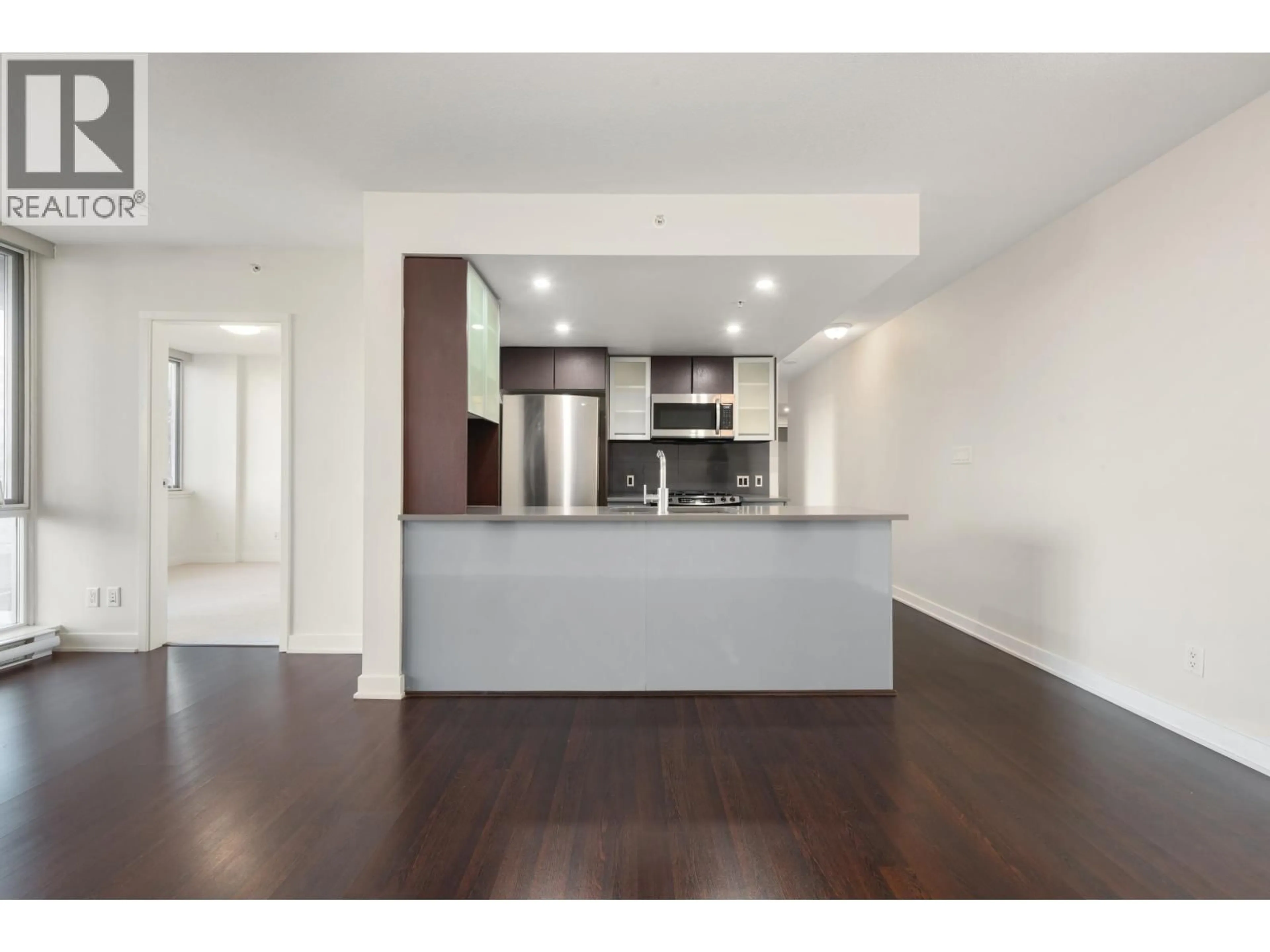 Open concept kitchen, wood/laminate floor for 302 - 7080 NO. 3 ROAD, Richmond British Columbia V6Y0B5