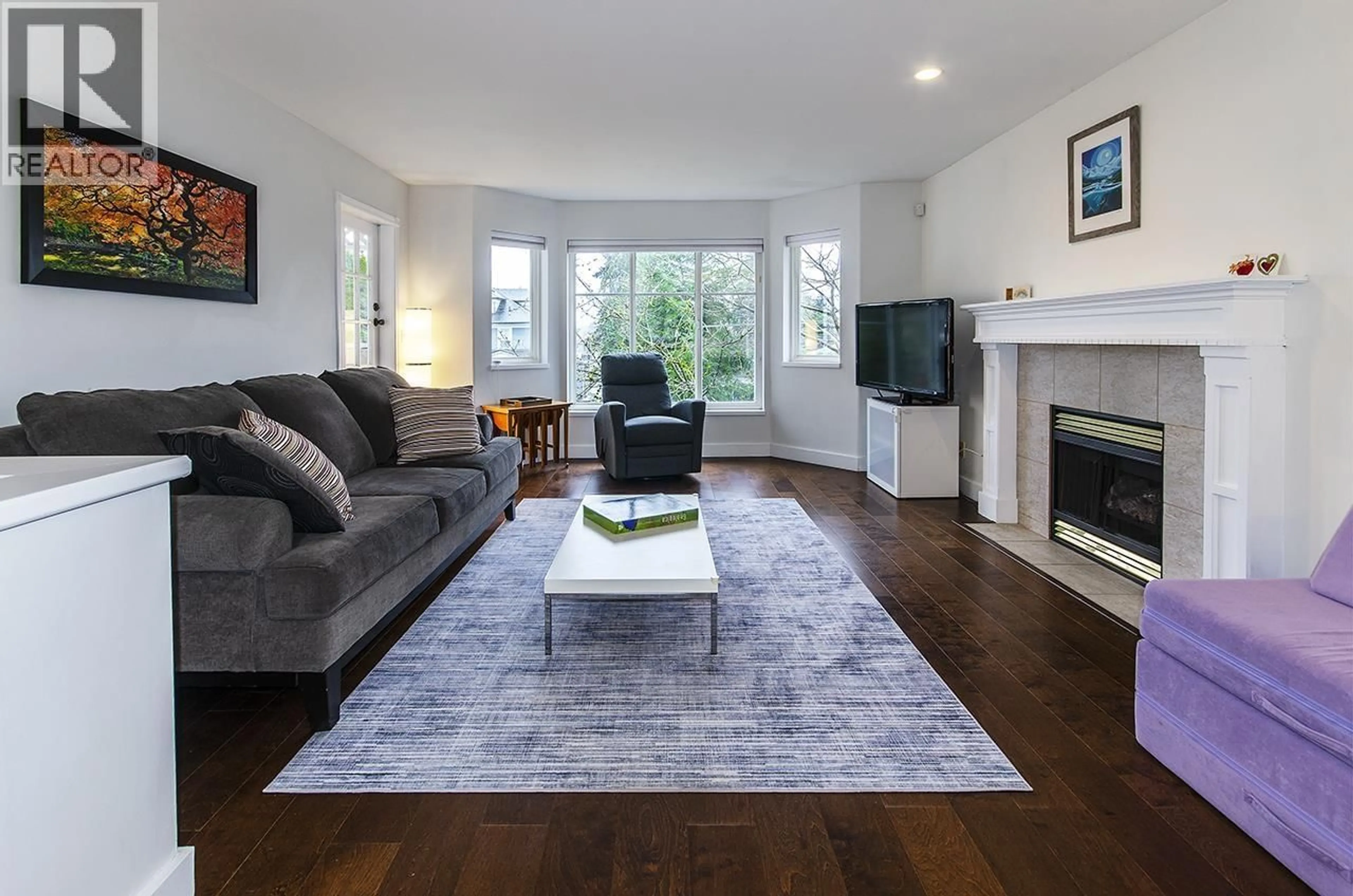 Living room with furniture, wood/laminate floor for 2062 MARY HILL ROAD, Port Coquitlam British Columbia V3C2Z8