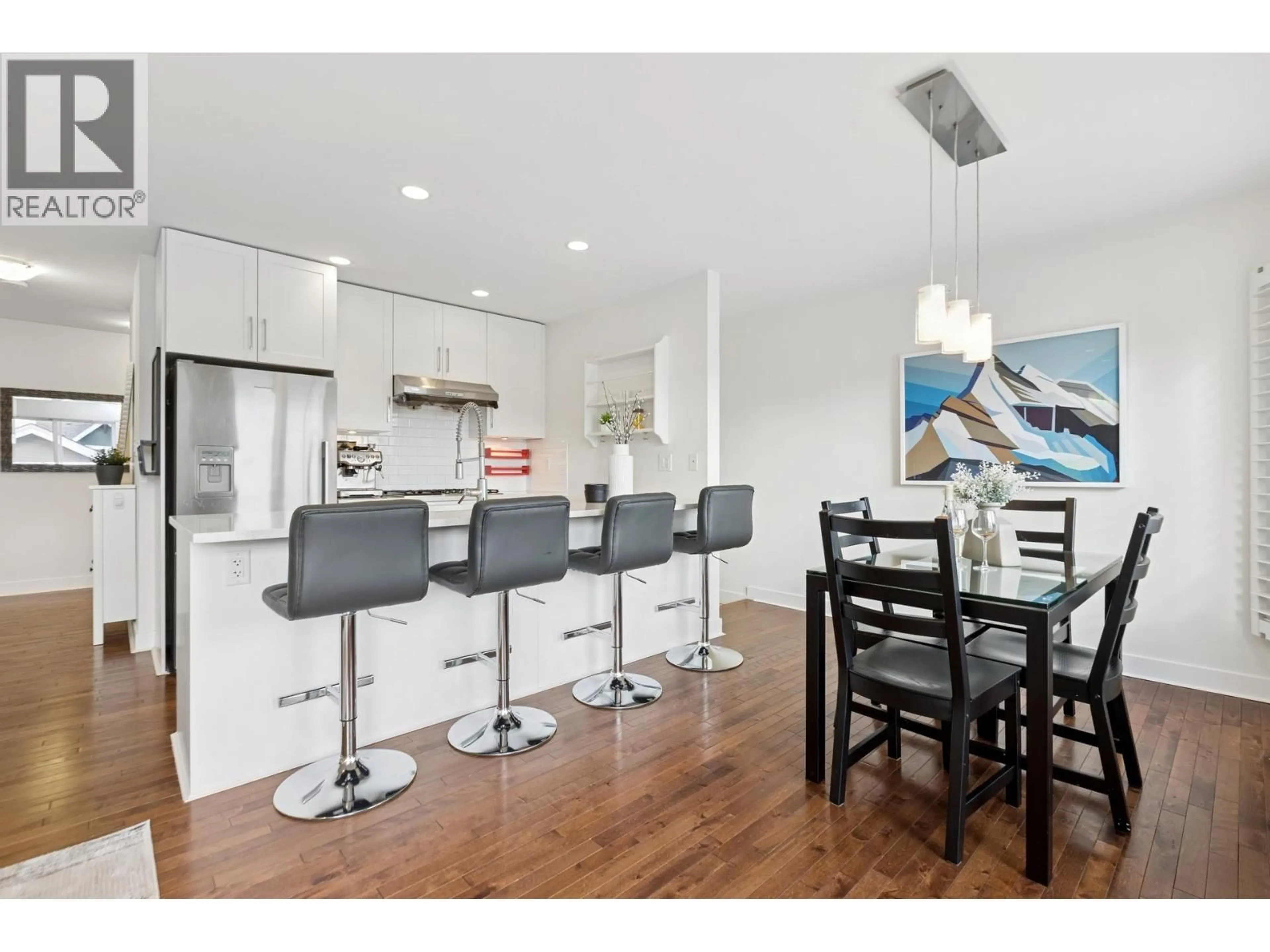 Open concept kitchen, wood/laminate floor for 205 18TH STREET, North Vancouver British Columbia V7L2X7