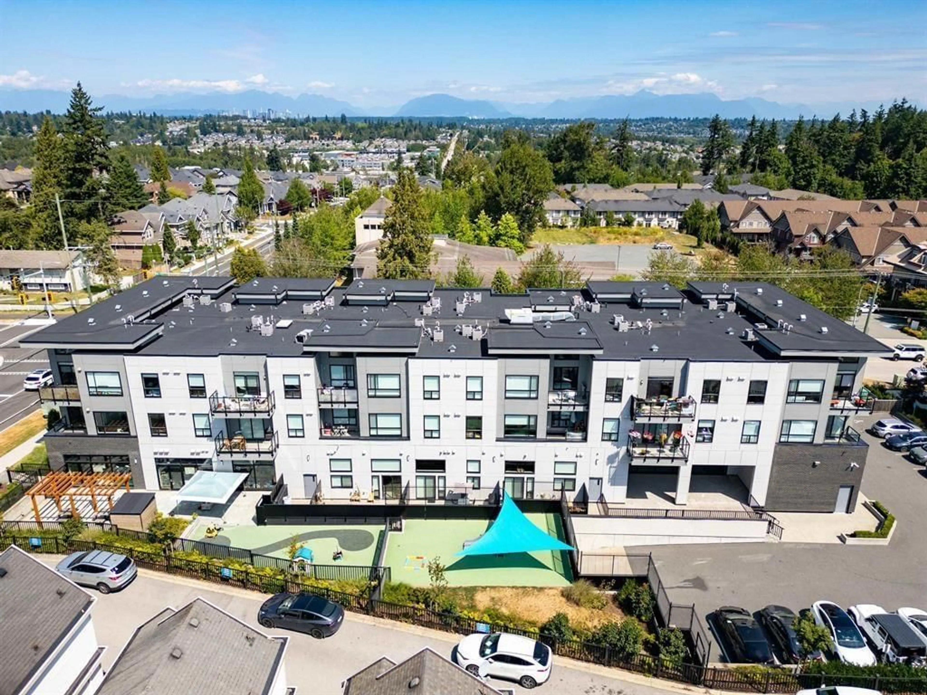 A pic from outside/outdoor area/front of a property/back of a property/a pic from drone, mountain view for 211 - 14818 60 AVENUE, Surrey British Columbia V3S1R9
