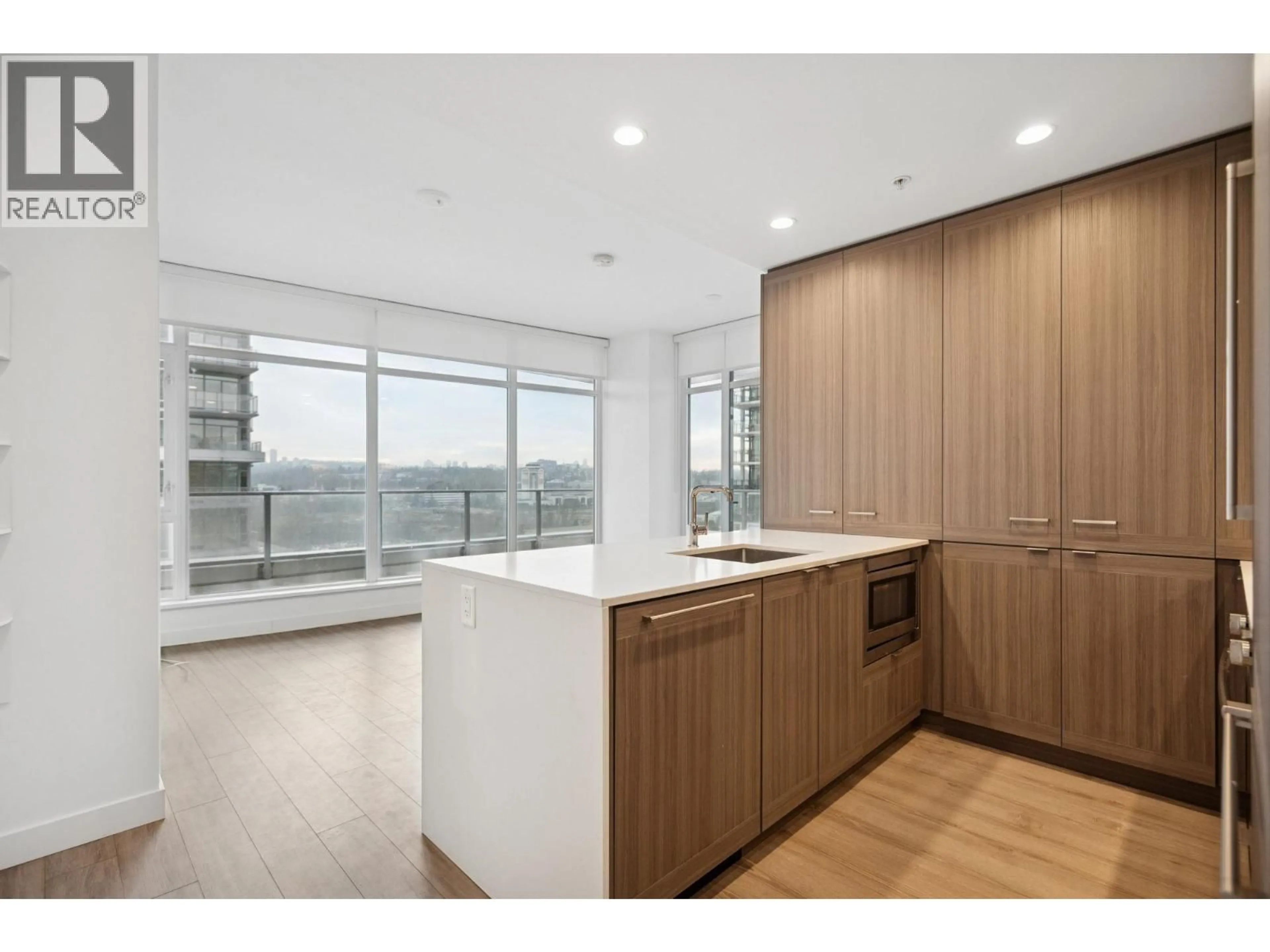 Open concept kitchen, wood/laminate floor for 1301 - 2311 BETA AVENUE, Burnaby British Columbia V5C5M8