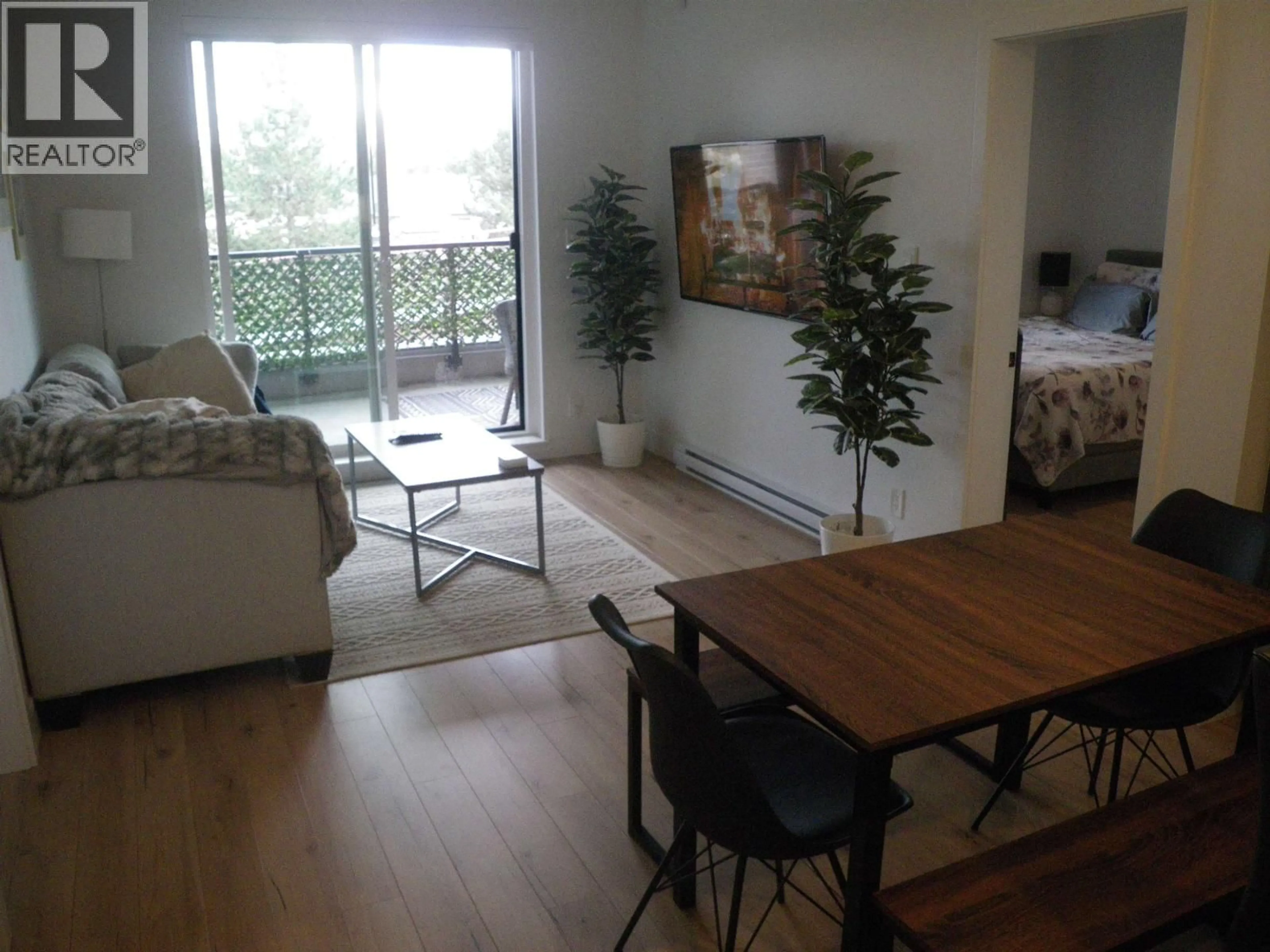 Living room with furniture, wood/laminate floor for 326 - 55 KLAHANIE DRIVE, Port Moody British Columbia V3H0M9