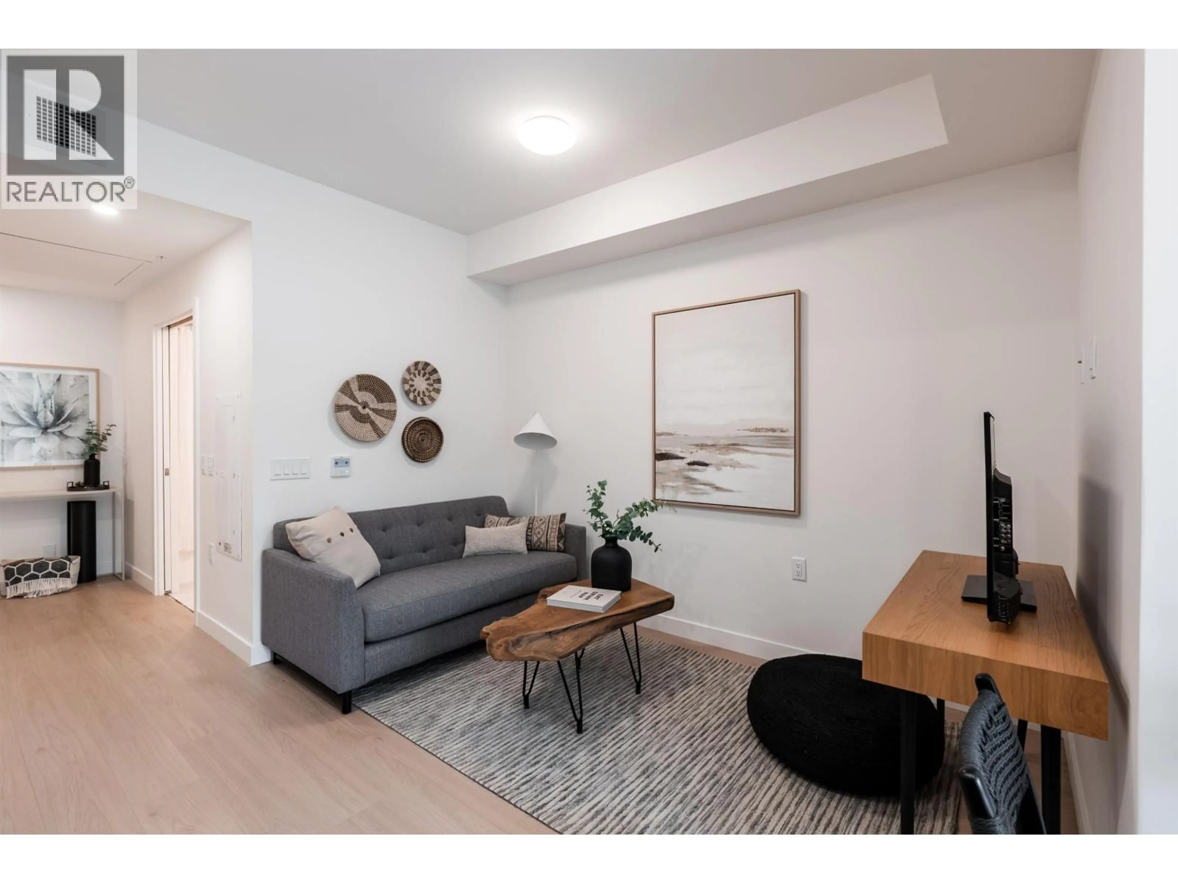 Living room with furniture, wood/laminate floor for 602 - 150 JAMES ROAD, Port Moody British Columbia V3H2S4