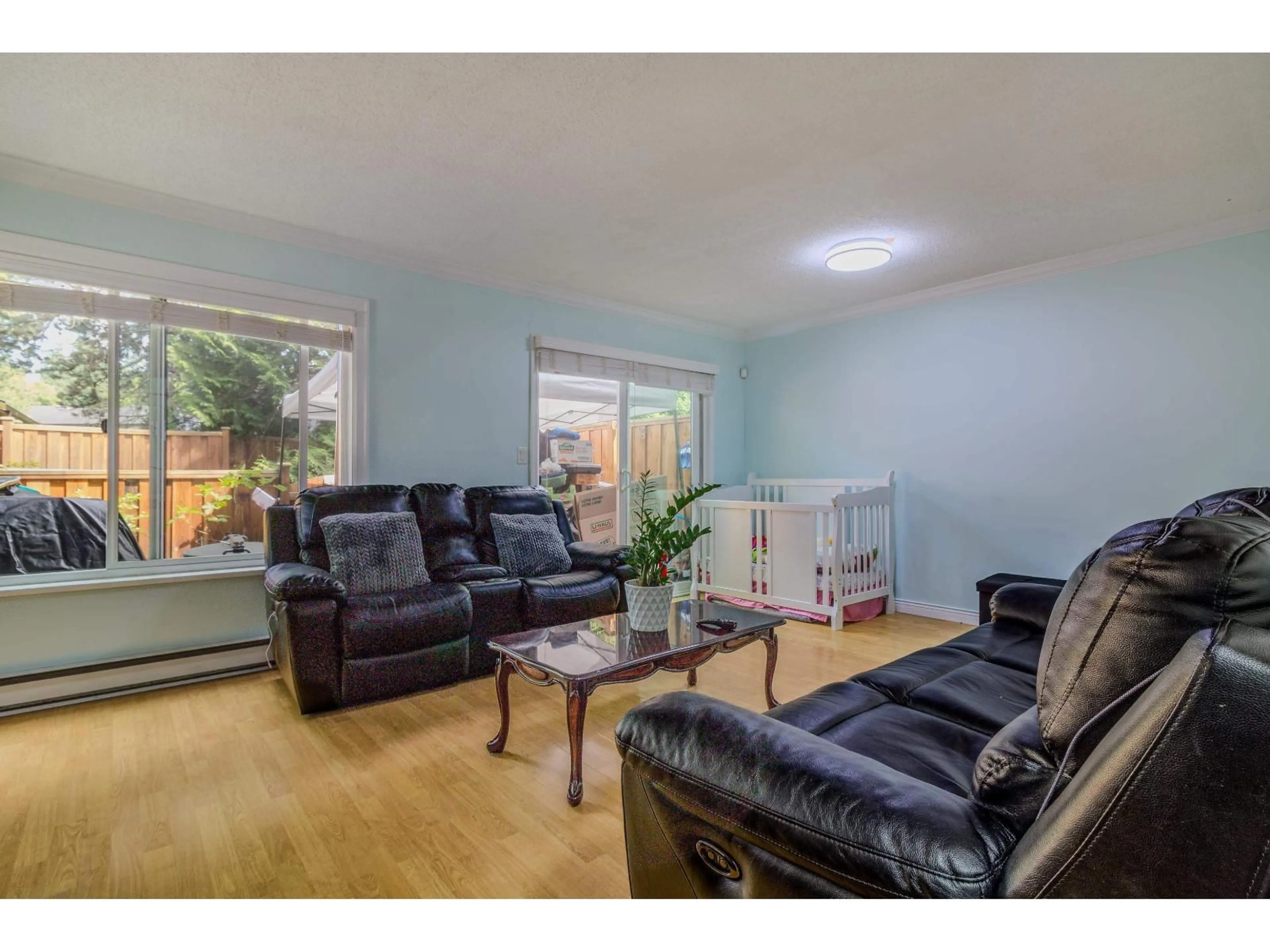 Living room with furniture, wood/laminate floor for 120 - 13880 74 AVENUE, Surrey British Columbia V3W7E6