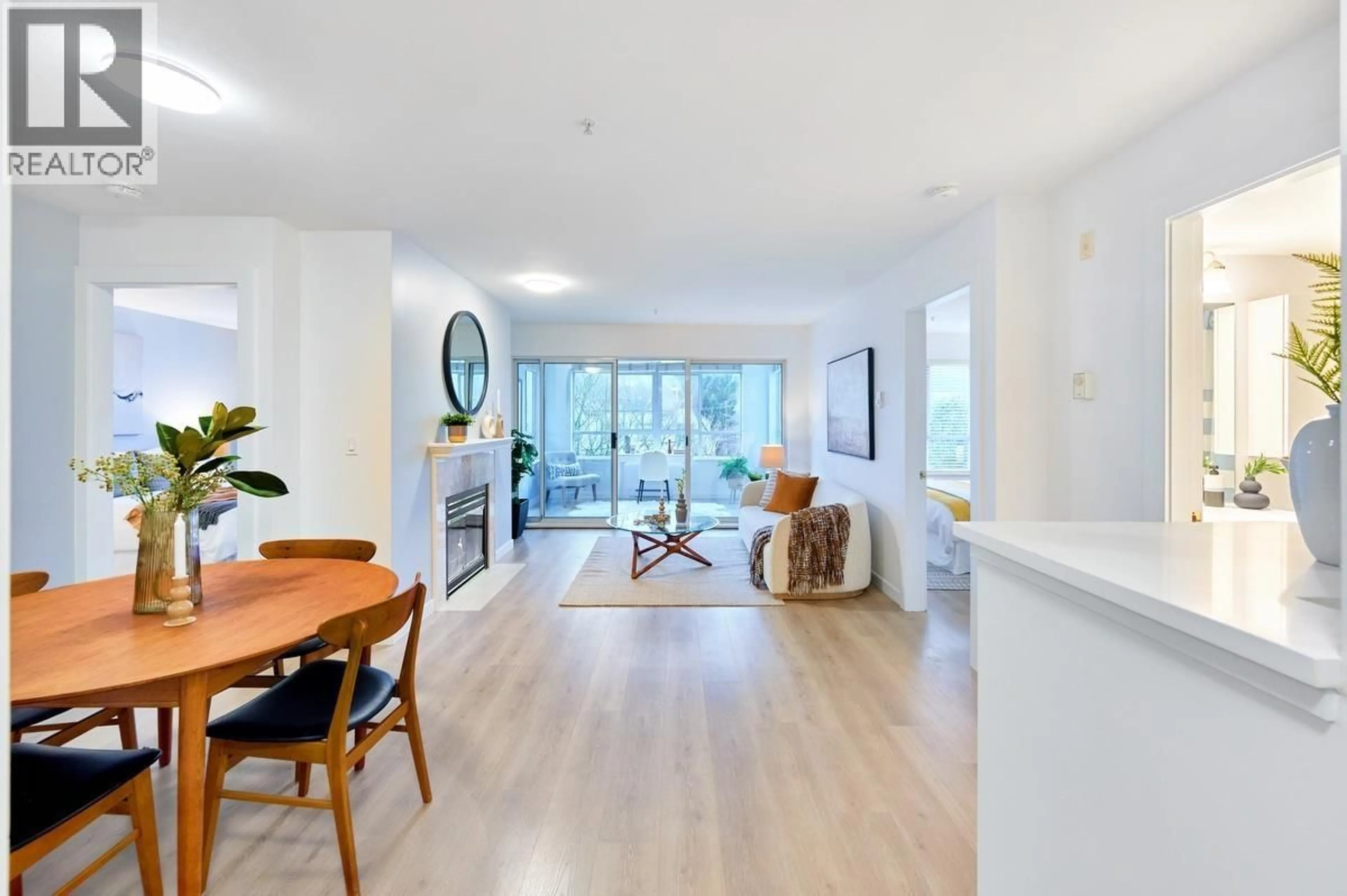 Open concept kitchen, wood/laminate floor for 313 - 855 16TH STREET, North Vancouver British Columbia V7P1R2