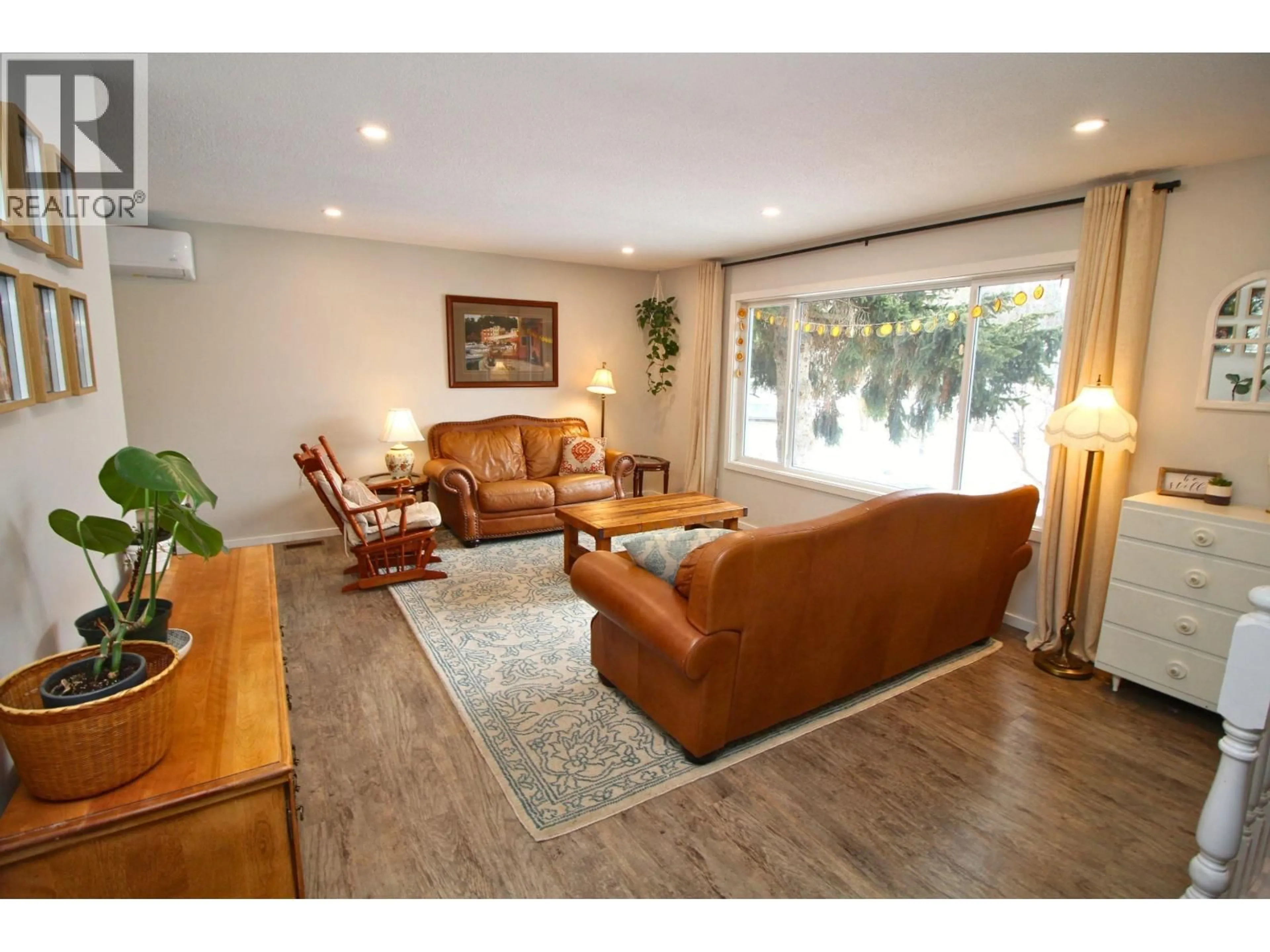 Living room with furniture, wood/laminate floor for 2270 BAGGERMAN PLACE, Houston British Columbia V0J1Z2
