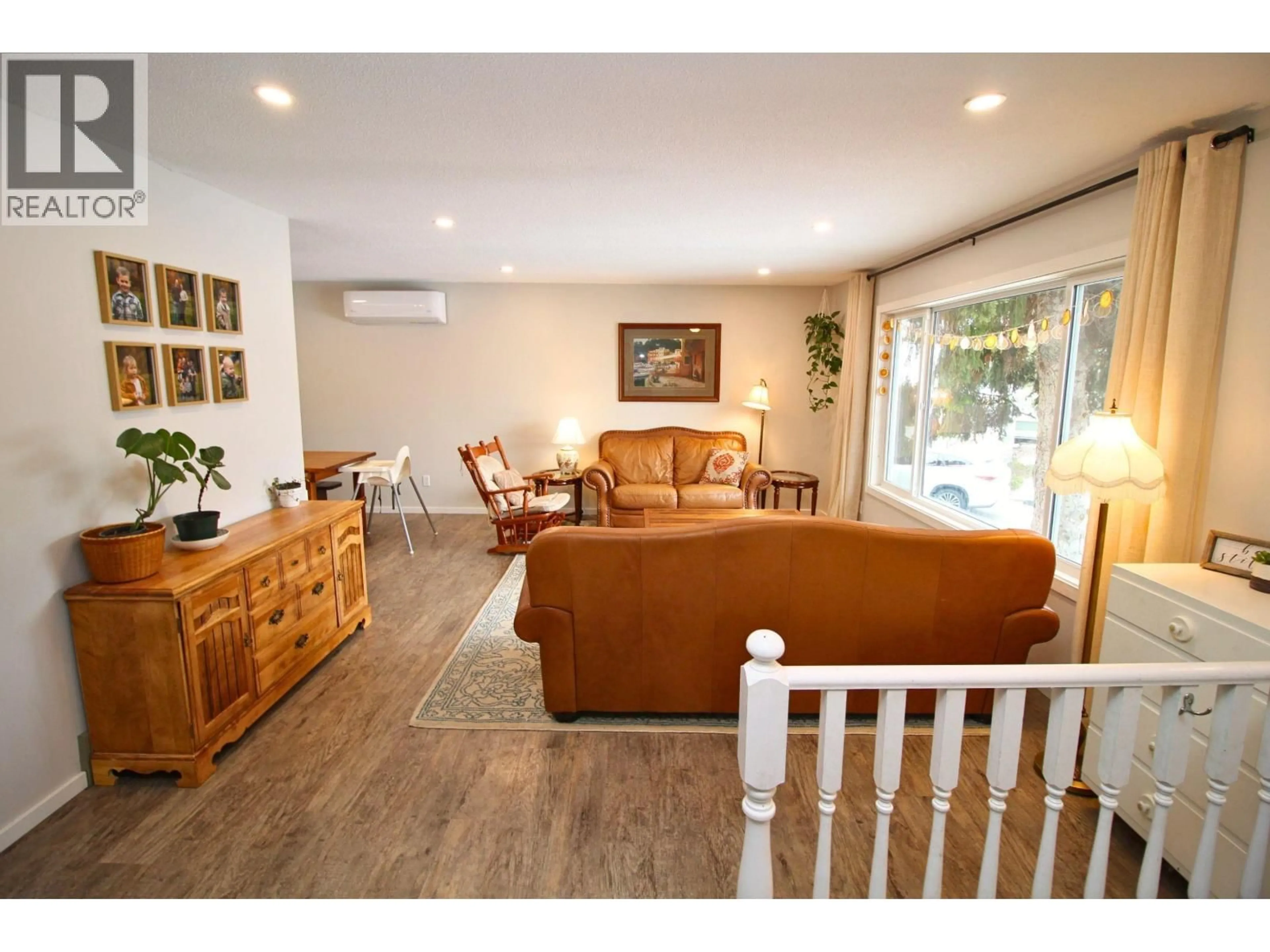 Living room with furniture, wood/laminate floor for 2270 BAGGERMAN PLACE, Houston British Columbia V0J1Z2