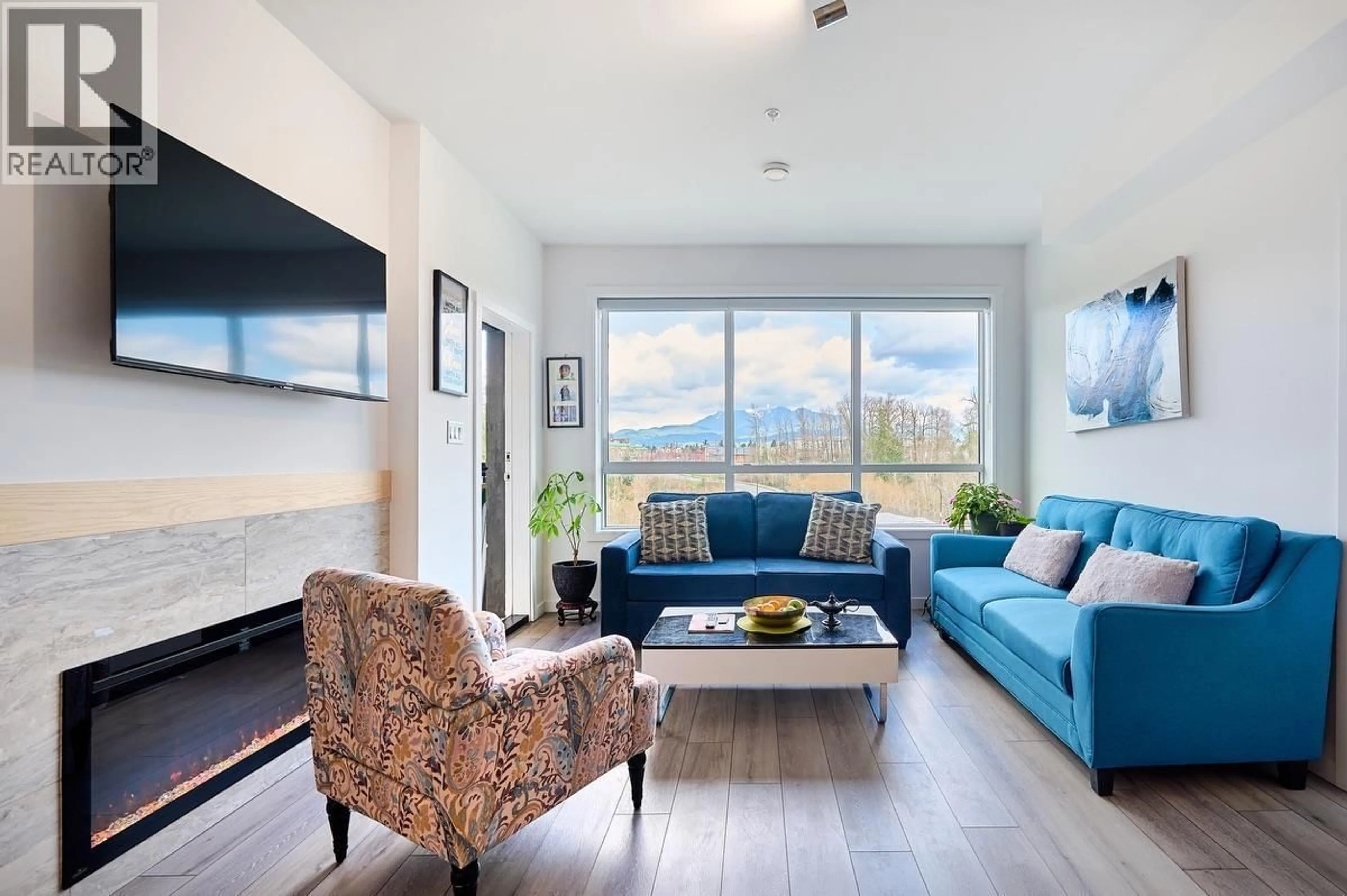 Living room with furniture, wood/laminate floor for 317 - 11641 227 STREET, Maple Ridge British Columbia V2X9J6