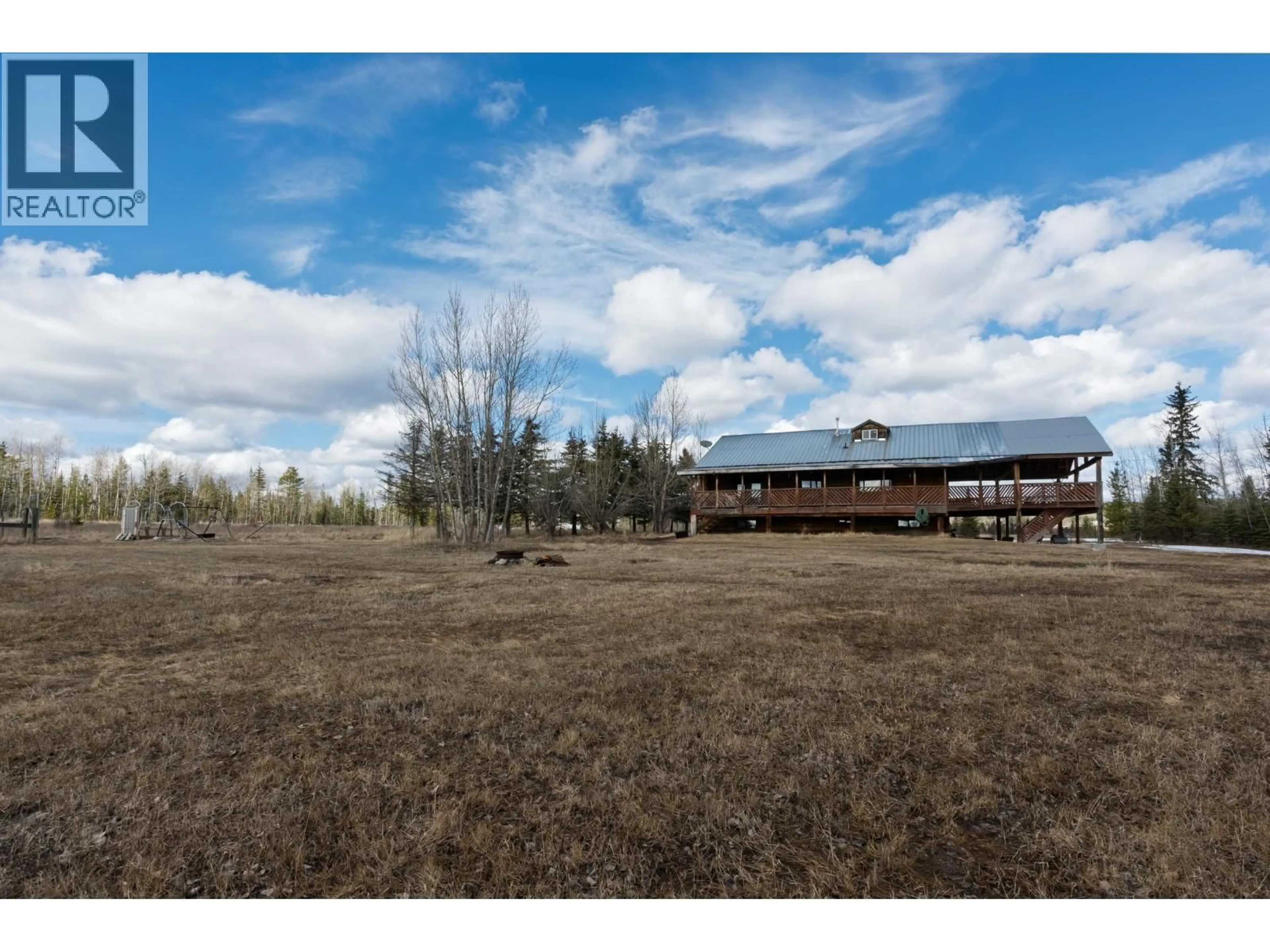 A pic from outside/outdoor area/front of a property/back of a property/a pic from drone, unknown for 2293 DOYLE ROAD, 150 Mile House British Columbia V0K2G0