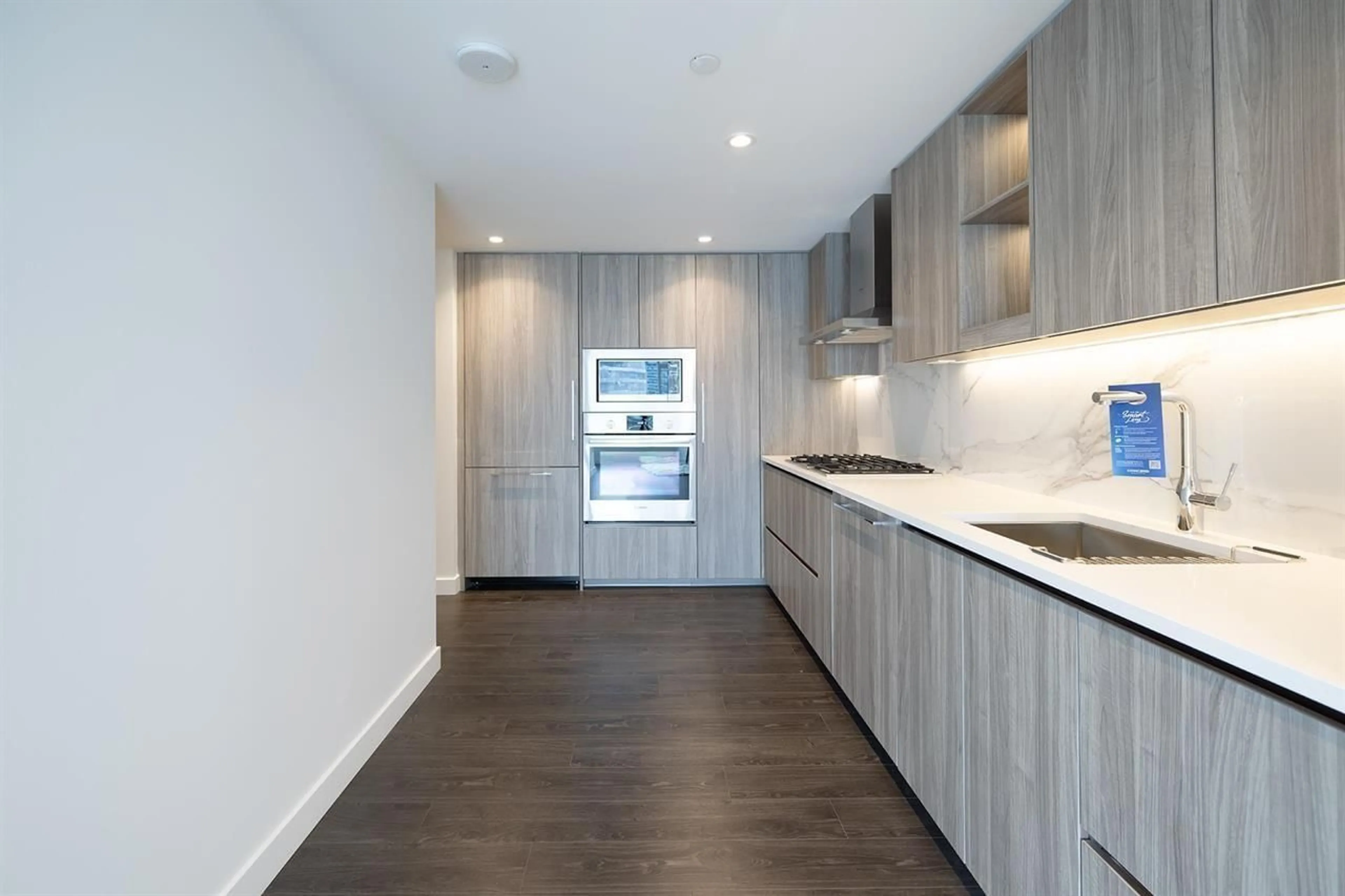 Open concept kitchen, wood/laminate floor for 2110 - 9887 WHALLEY BOULEVARD, Surrey British Columbia V3T0P4