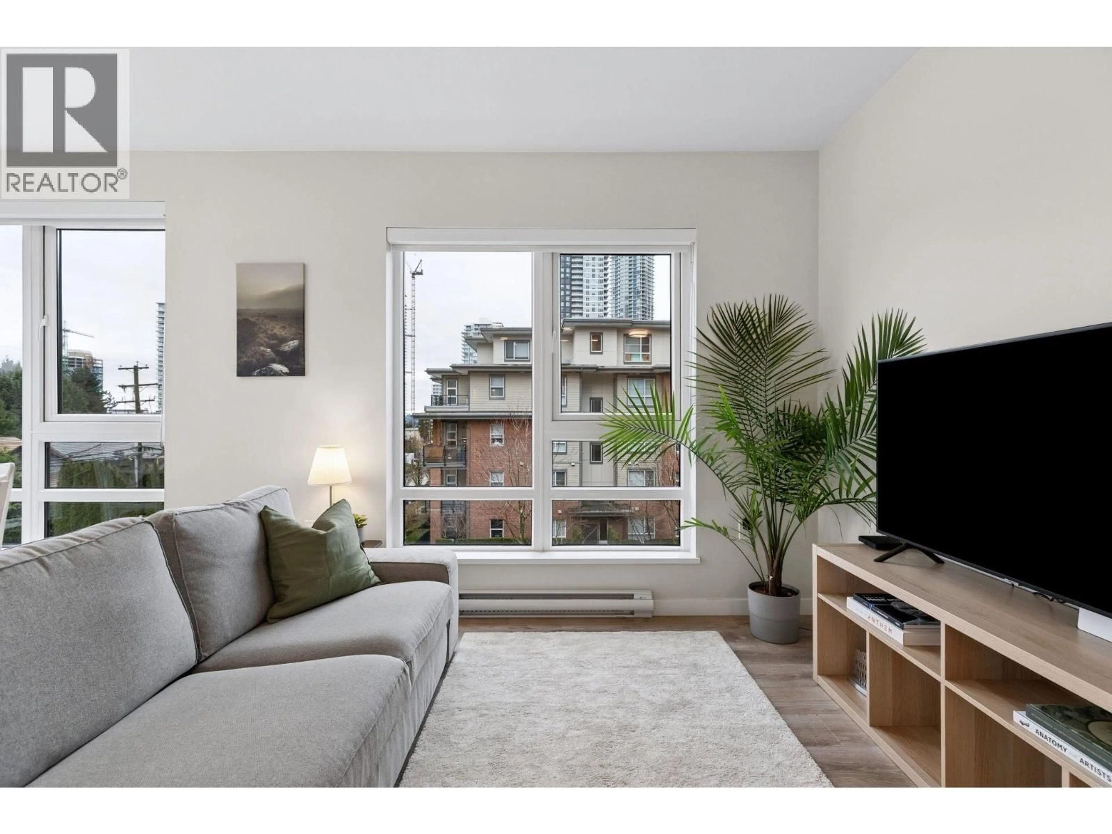 Living room with furniture, wood/laminate floor for 315 - 615 COTTONWOOD AVENUE, Coquitlam British Columbia V3J2S5