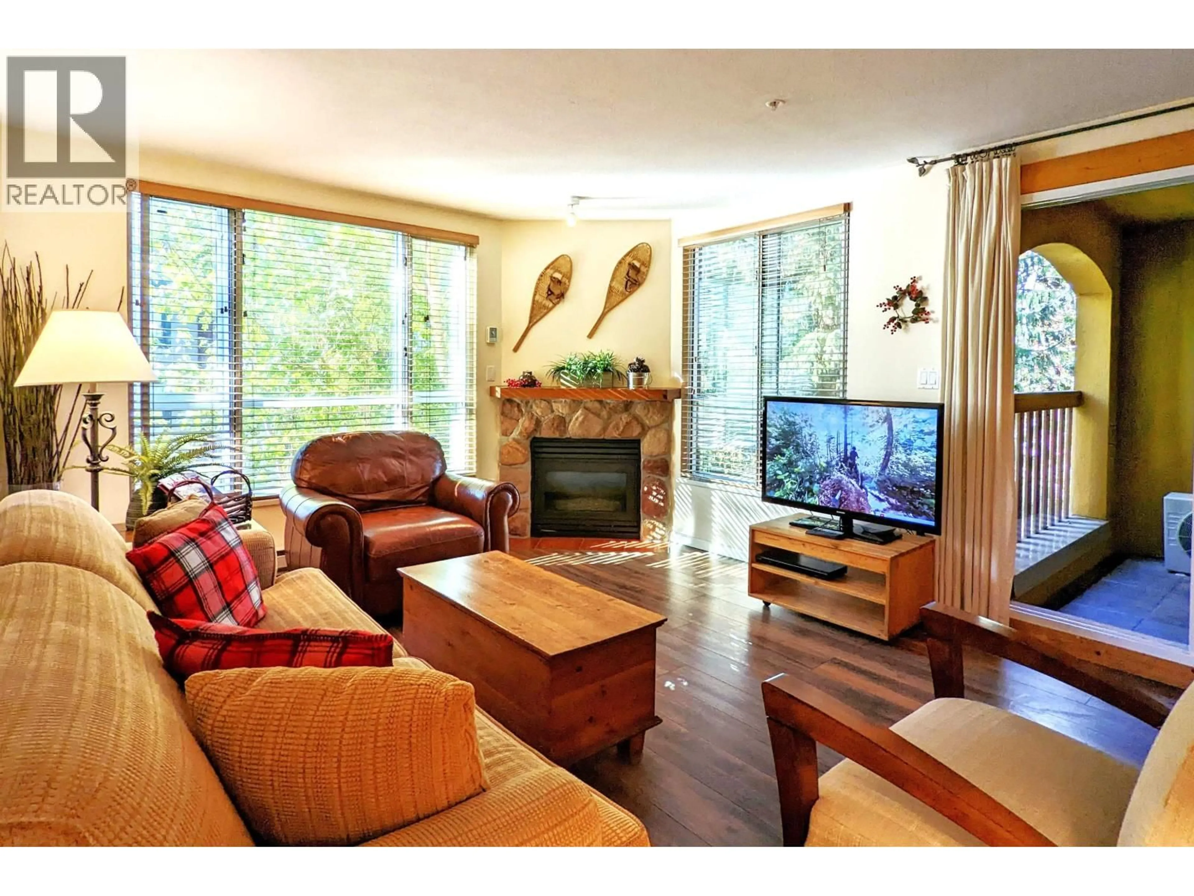 Living room with furniture, wood/laminate floor for 311 - 4314 MAIN STREET, Whistler British Columbia V8E1A8