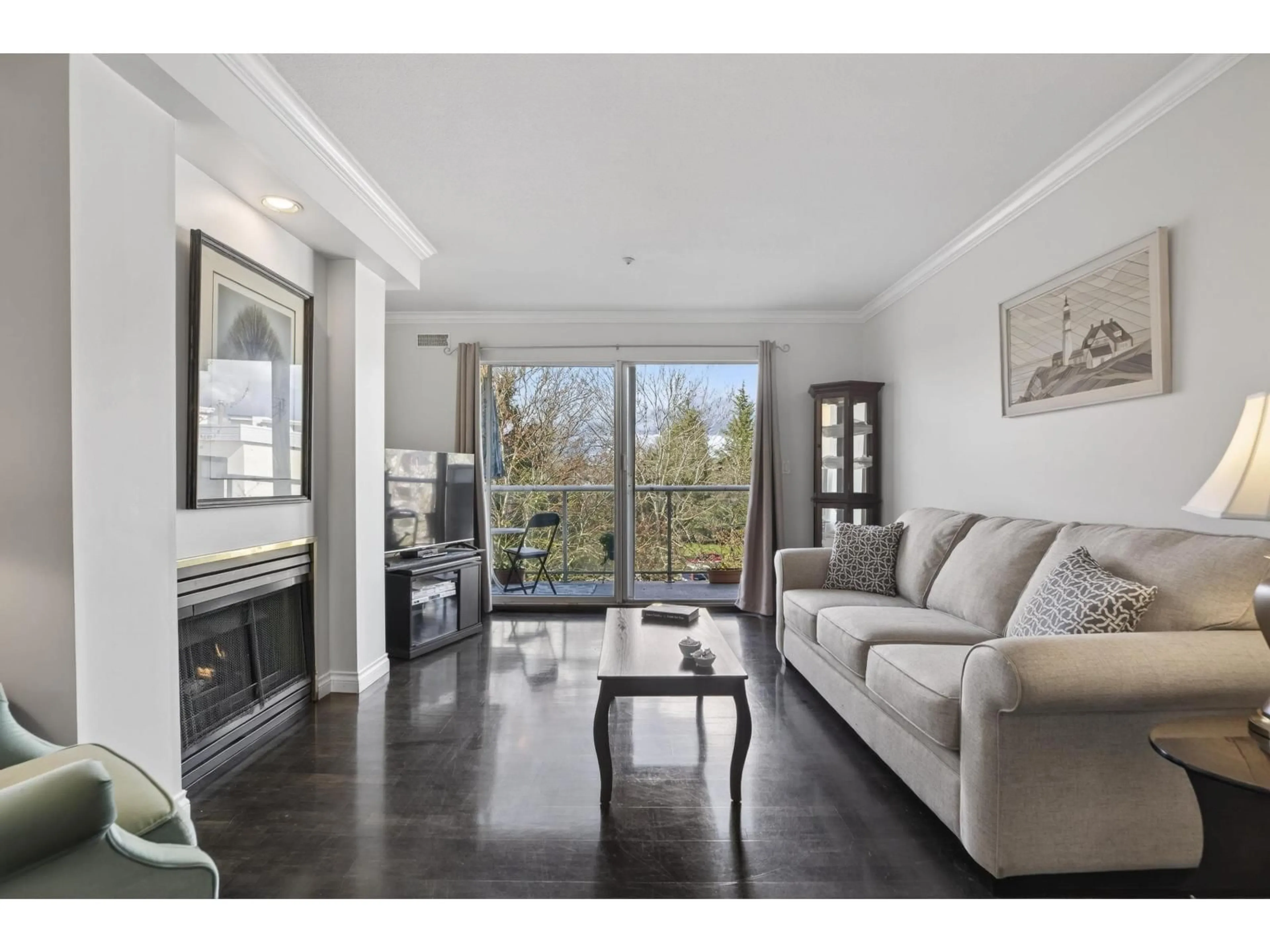 Living room with furniture, wood/laminate floor for 314 - 20177 54A AVENUE, Langley British Columbia V3A3W6