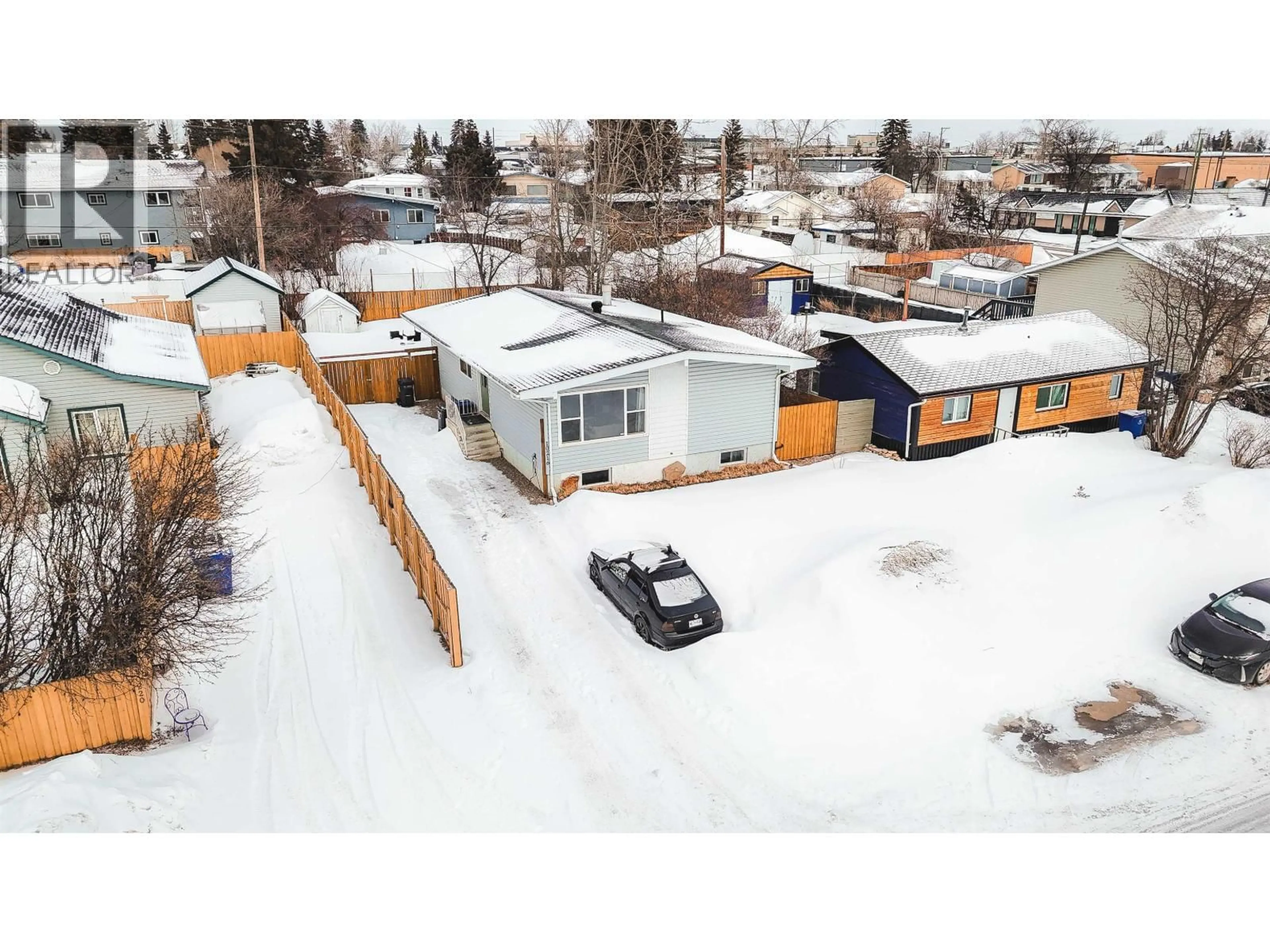 A pic from outside/outdoor area/front of a property/back of a property/a pic from drone, street for 10216 103 AVENUE, Fort St. John British Columbia V1J2H8