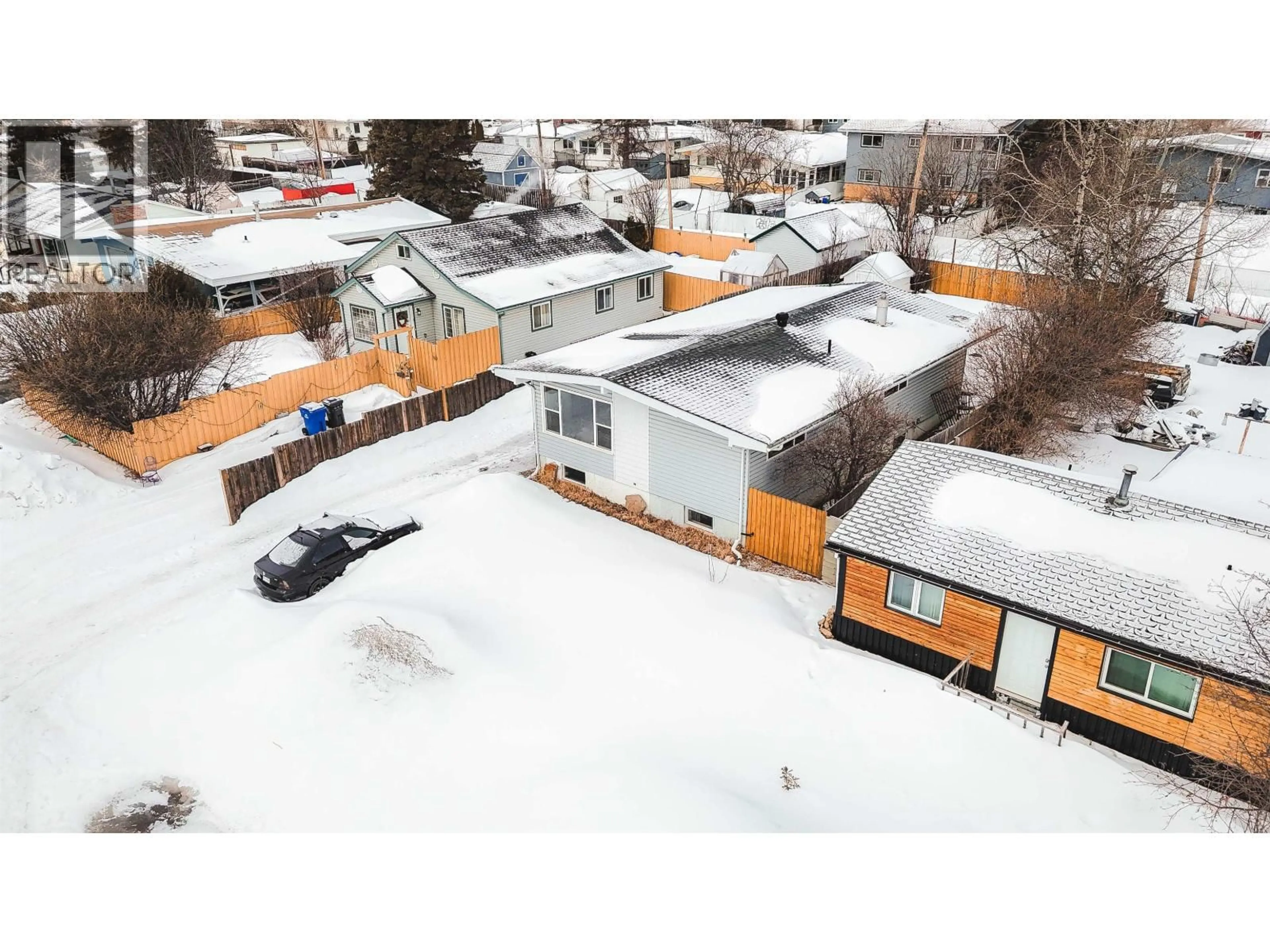 A pic from outside/outdoor area/front of a property/back of a property/a pic from drone, street for 10216 103 AVENUE, Fort St. John British Columbia V1J2H8