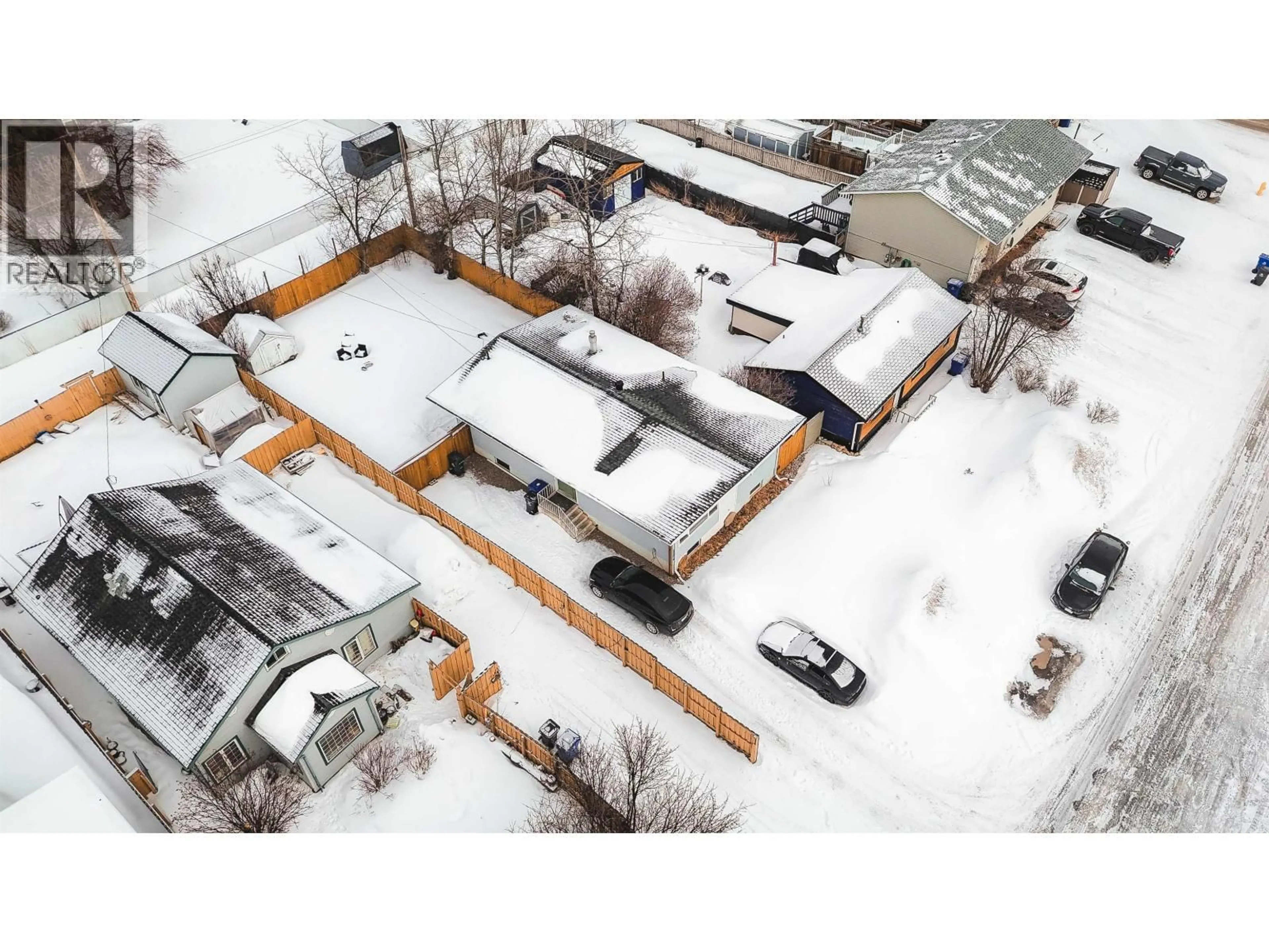 A pic from outside/outdoor area/front of a property/back of a property/a pic from drone, street for 10216 103 AVENUE, Fort St. John British Columbia V1J2H8