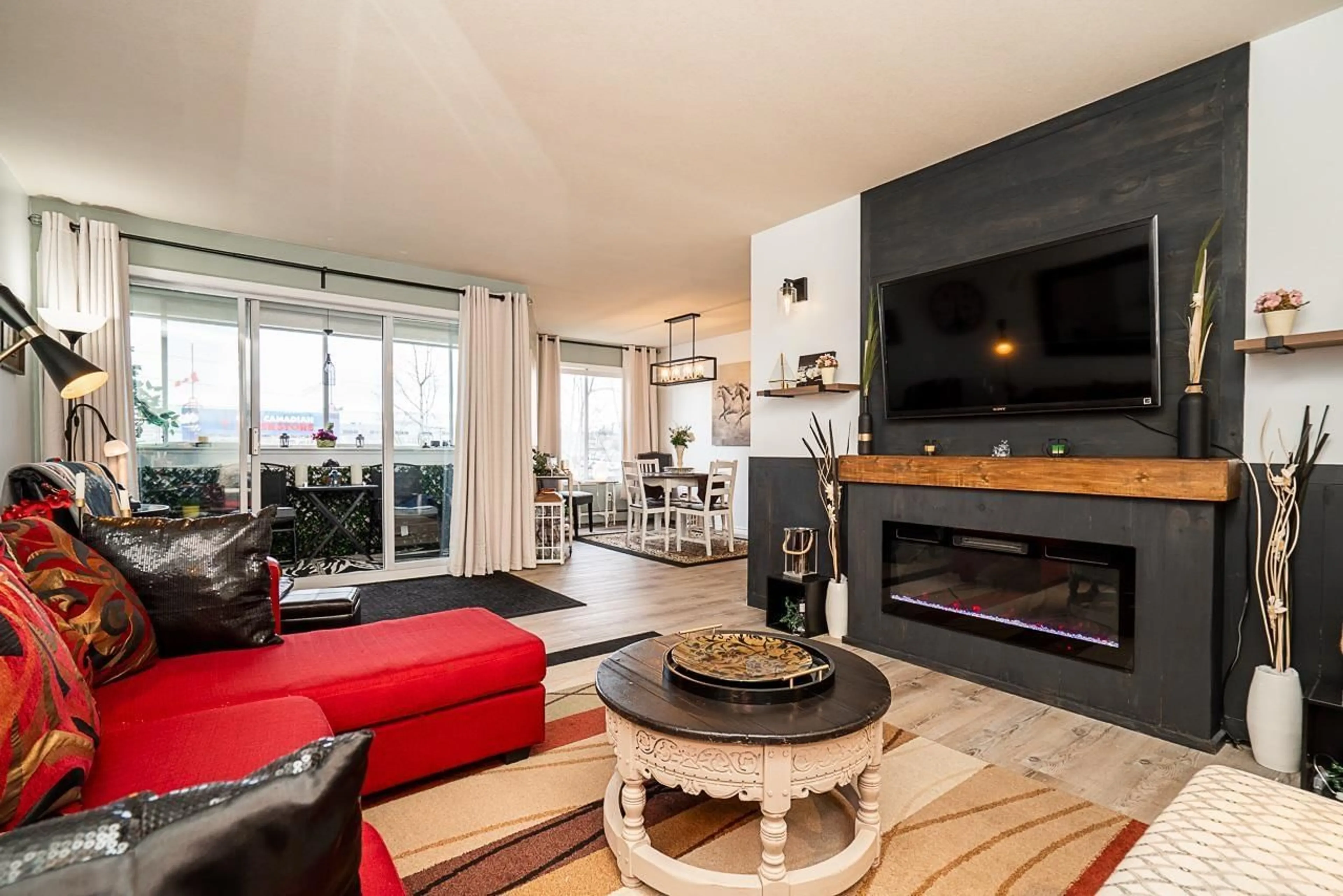 Living room with furniture, wood/laminate floor for 306 - 32823 LANDEAU PLACE, Abbotsford British Columbia V2S6S6