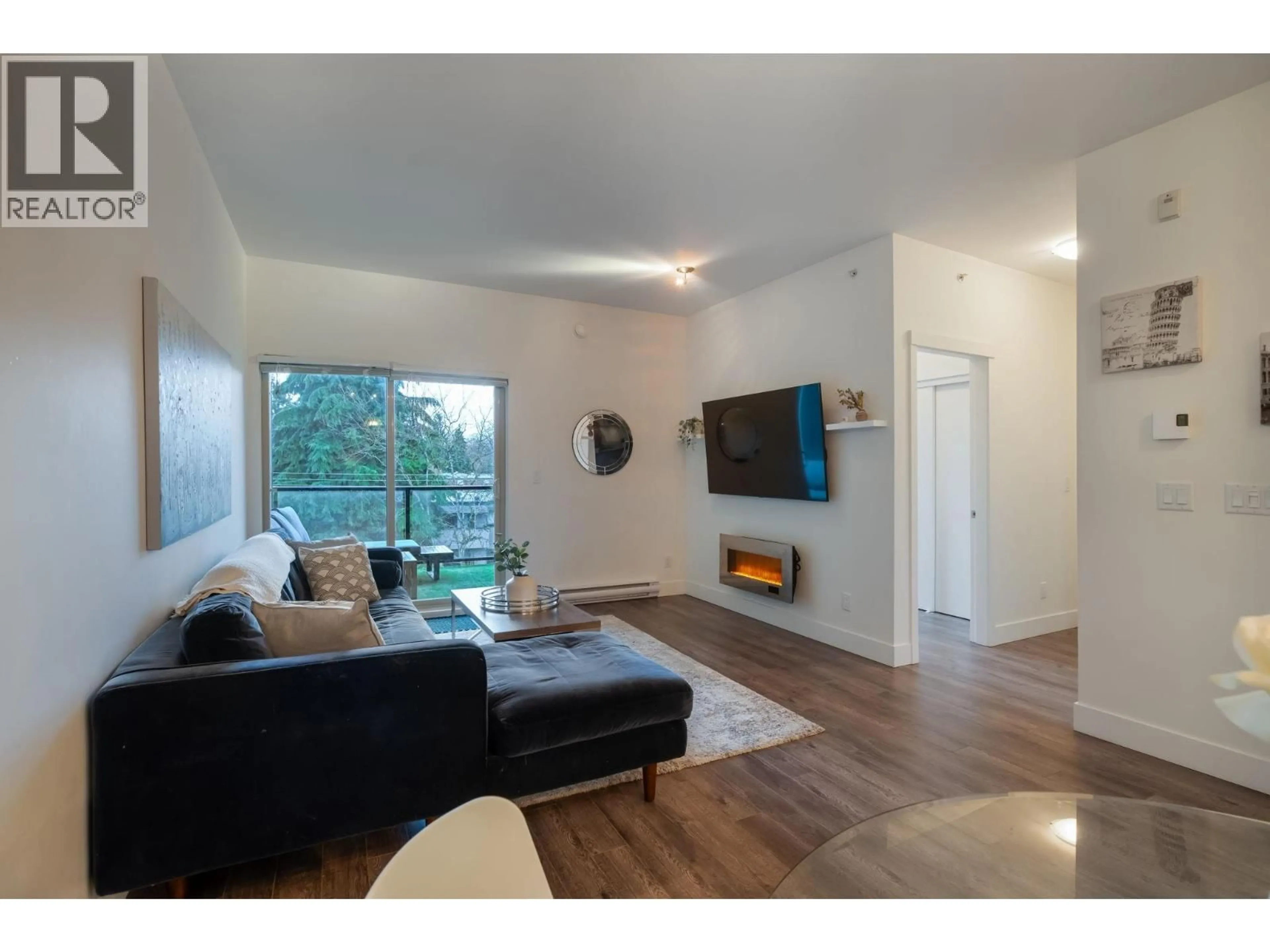 Living room with furniture, wood/laminate floor for 405 - 2436 KELLY AVENUE, Port Coquitlam British Columbia V3C1Y4
