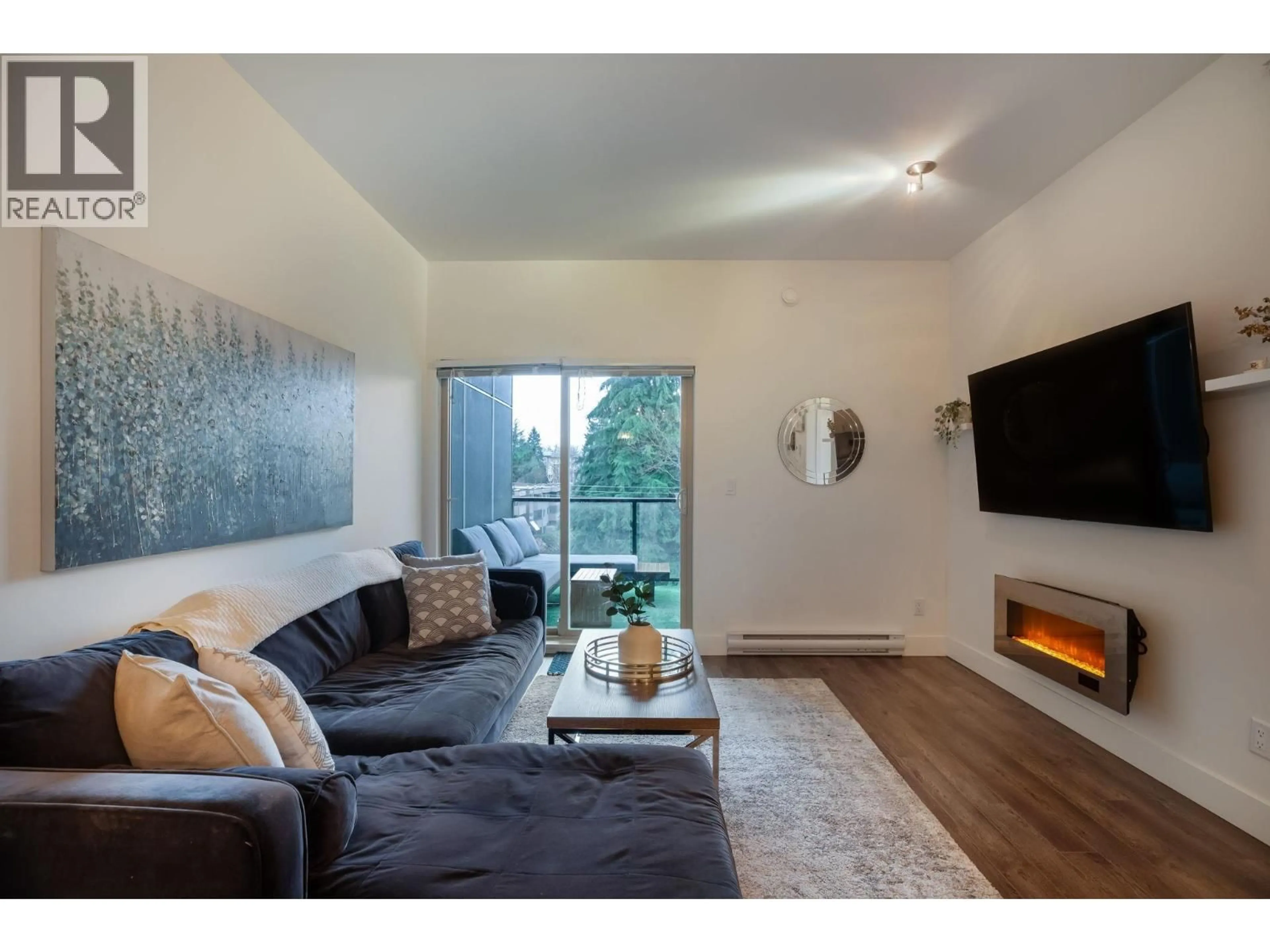 Living room with furniture, wood/laminate floor for 405 - 2436 KELLY AVENUE, Port Coquitlam British Columbia V3C1Y4