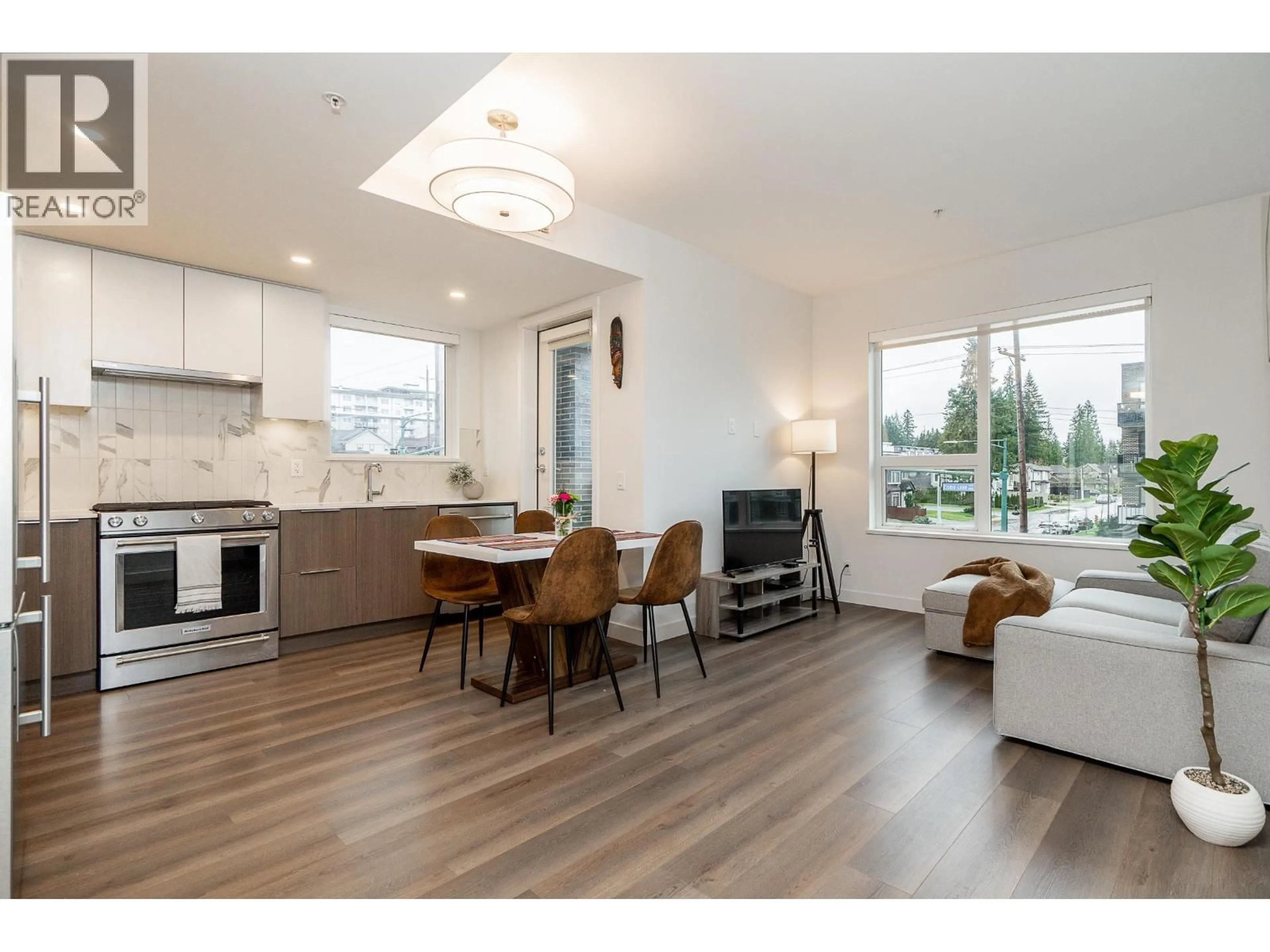 Open concept kitchen, wood/laminate floor for 304 - 645 COMO LAKE AVENUE, Coquitlam British Columbia V3J0N9