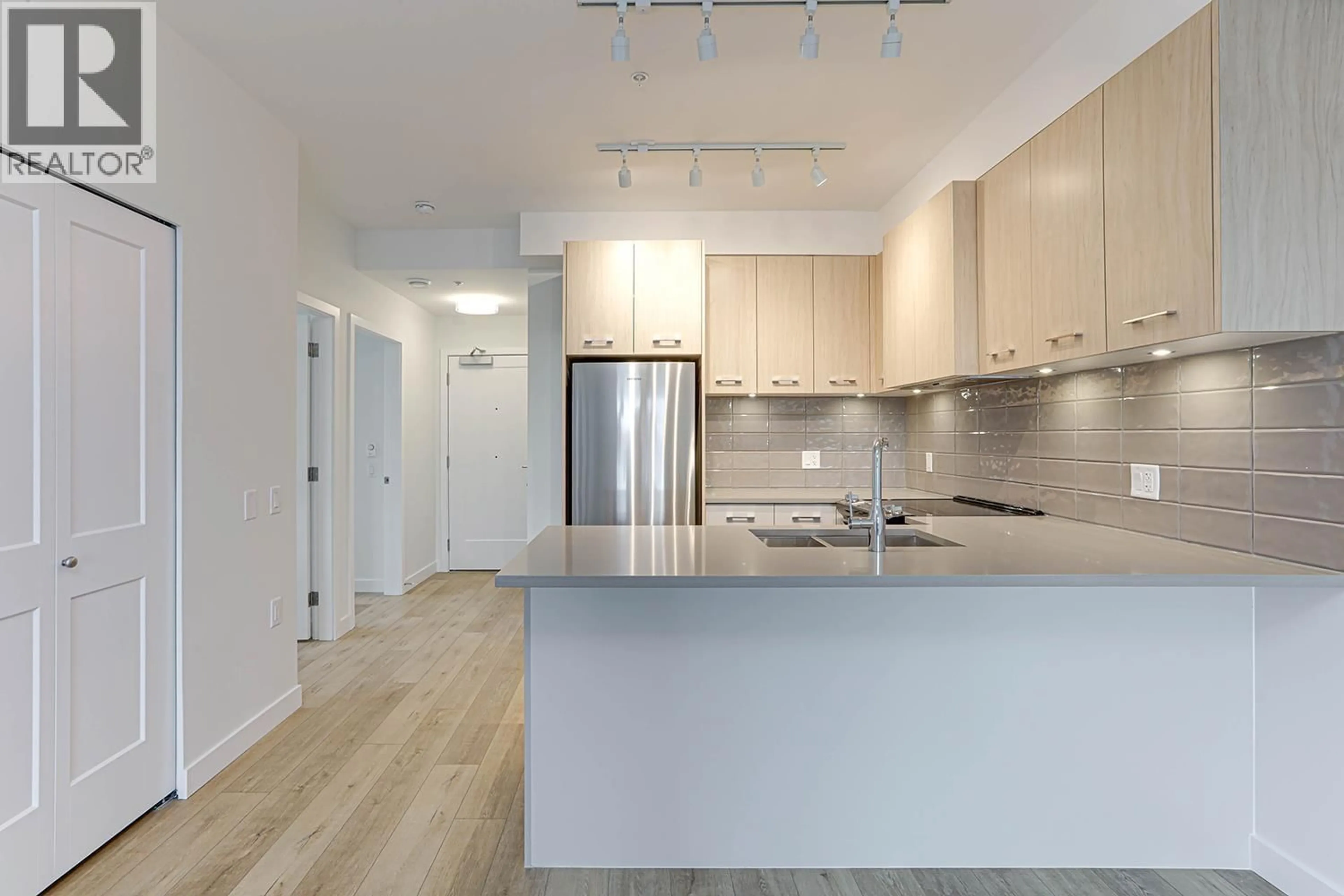 Open concept kitchen, unknown for 206 - 4933 CLARENDON STREET, Vancouver British Columbia V5R0J6