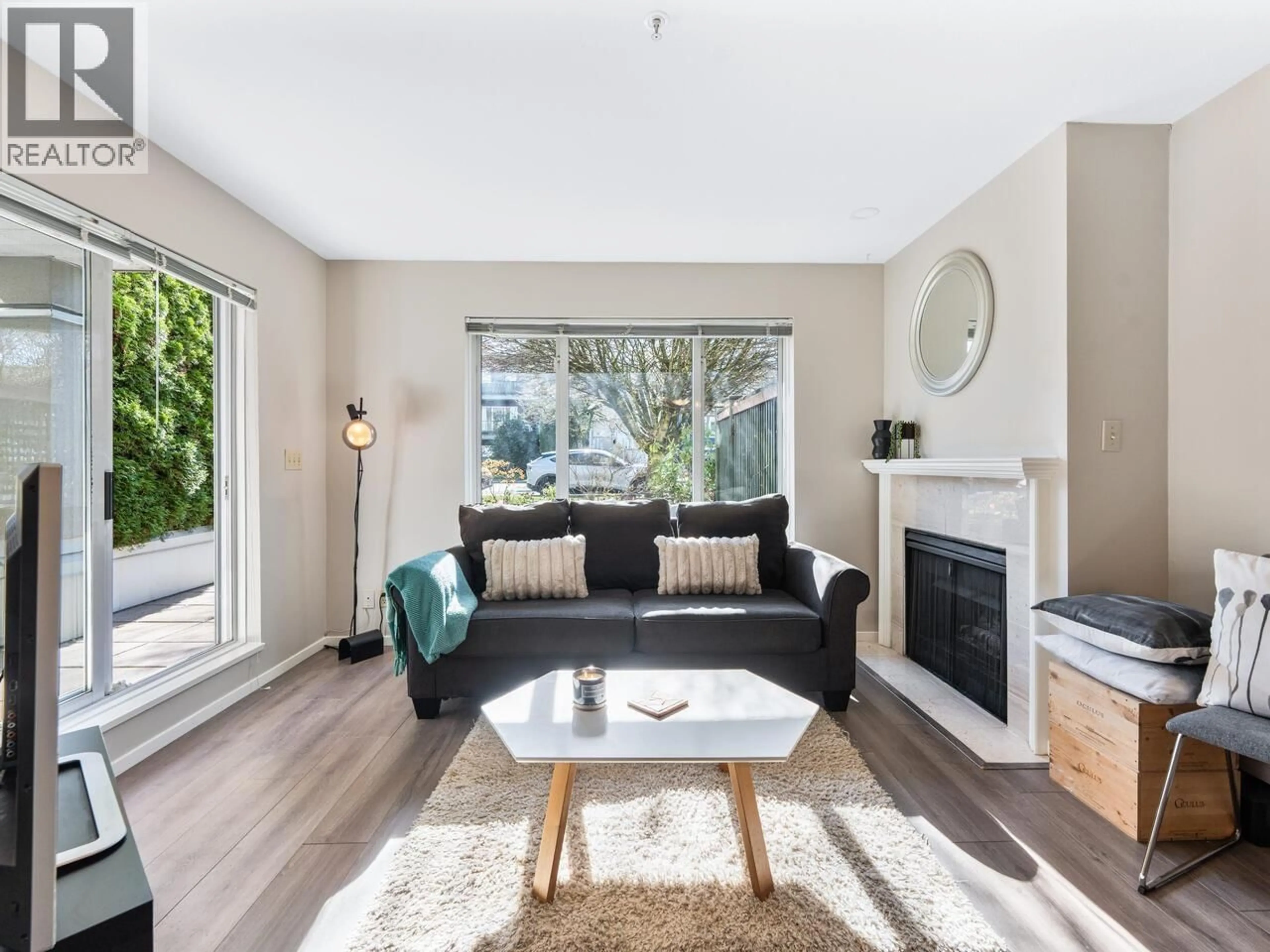 Living room with furniture, wood/laminate floor for 102 - 2195 5TH AVENUE, Vancouver British Columbia V6K1S1