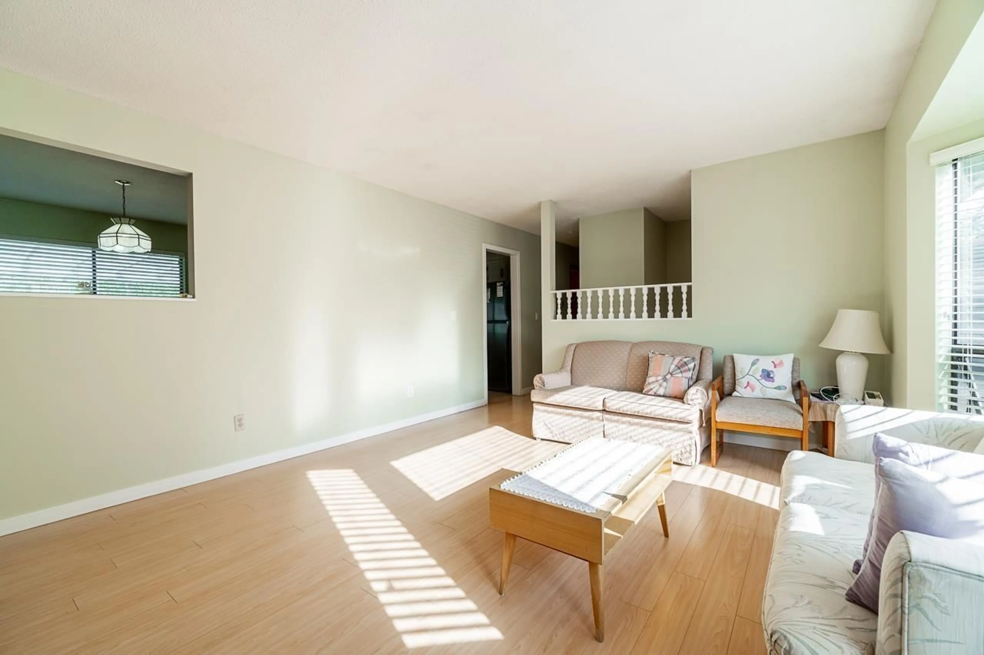 Living room with furniture, wood/laminate floor for 8839 156A STREET, Surrey British Columbia V4N2Y2