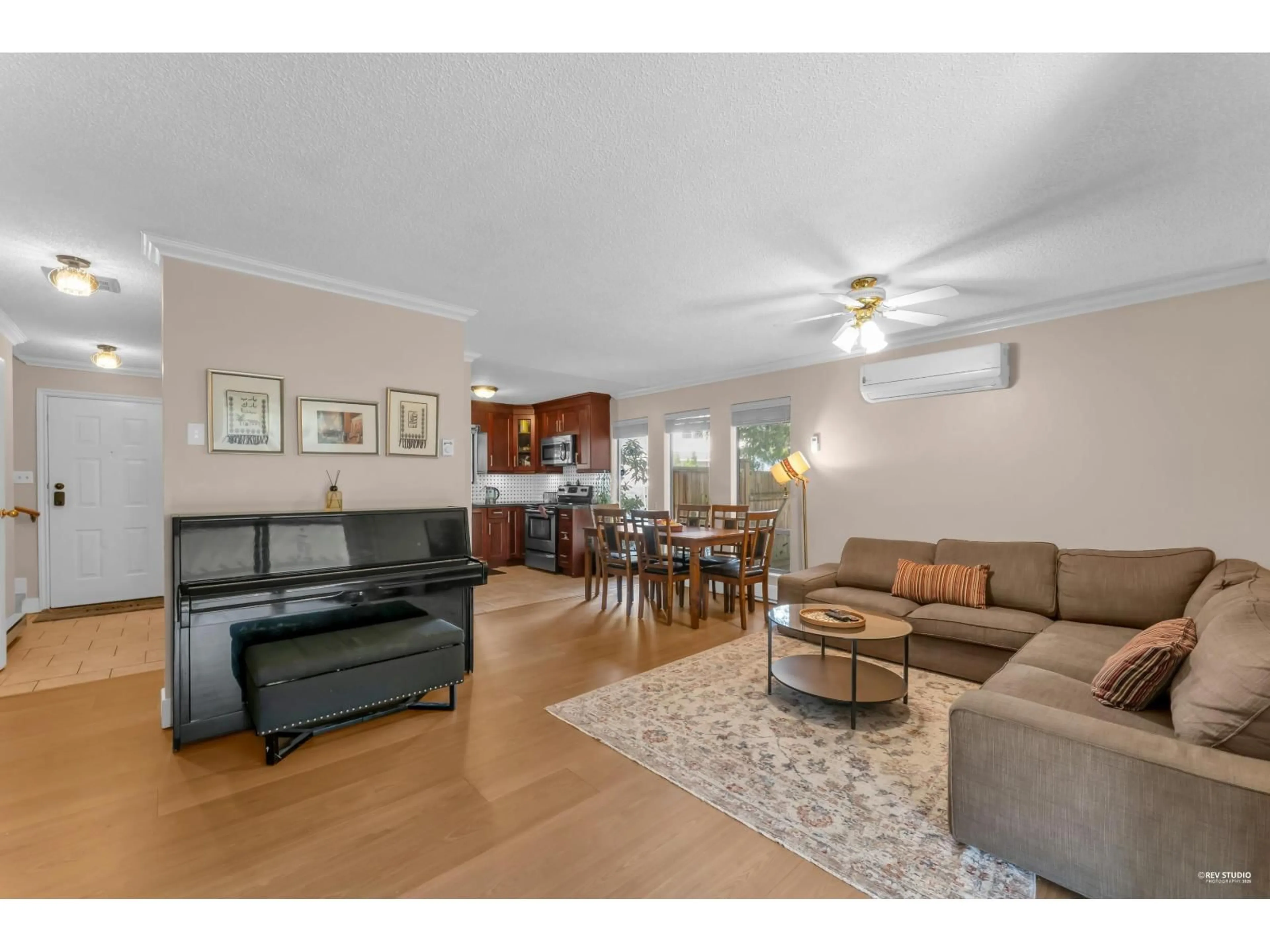 Living room with furniture, wood/laminate floor for 6717 141 STREET, Surrey British Columbia V3W6X2