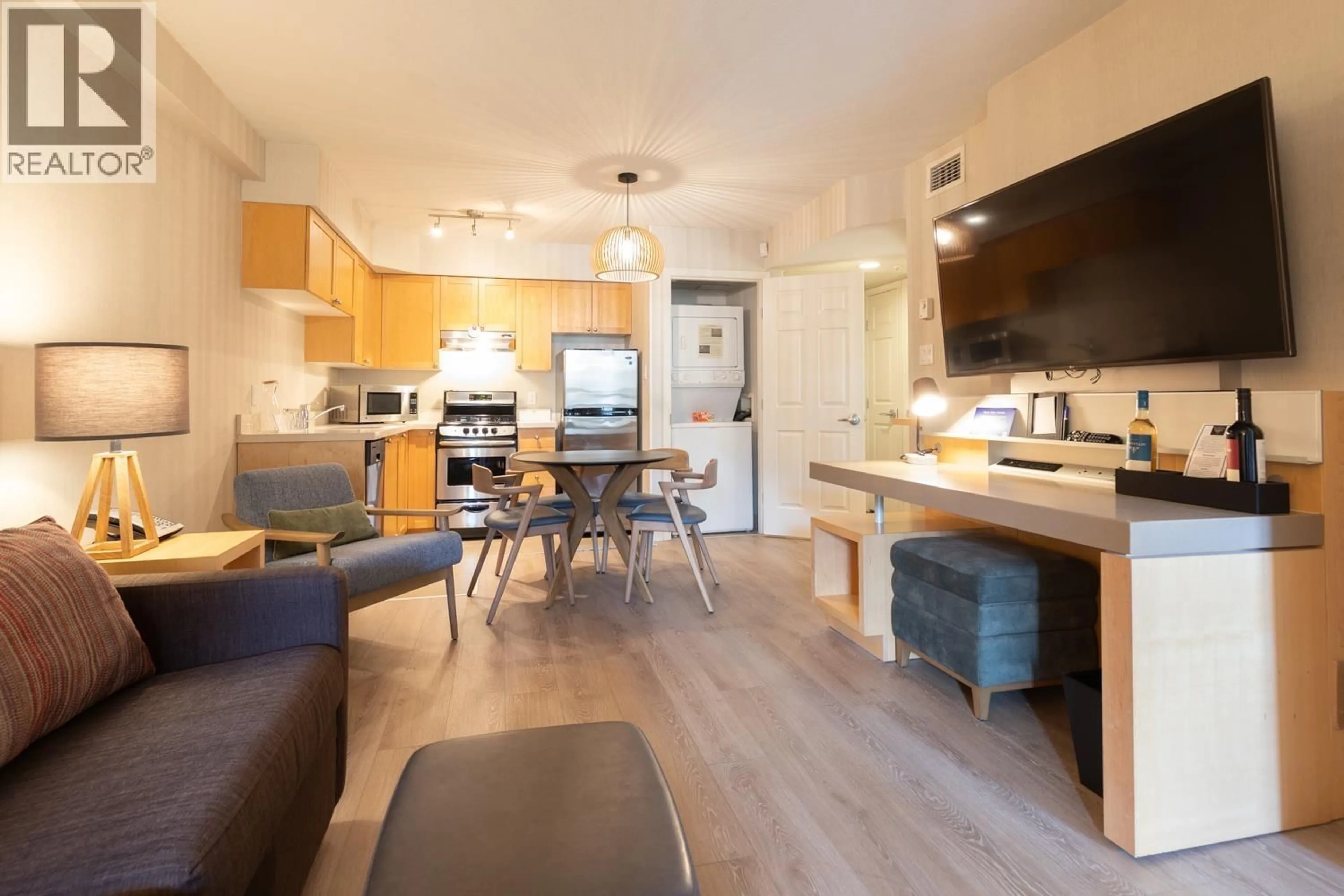 Open concept kitchen, wood/laminate floor for 2236 - 4308 MAIN STREET, Whistler British Columbia V8E1A9