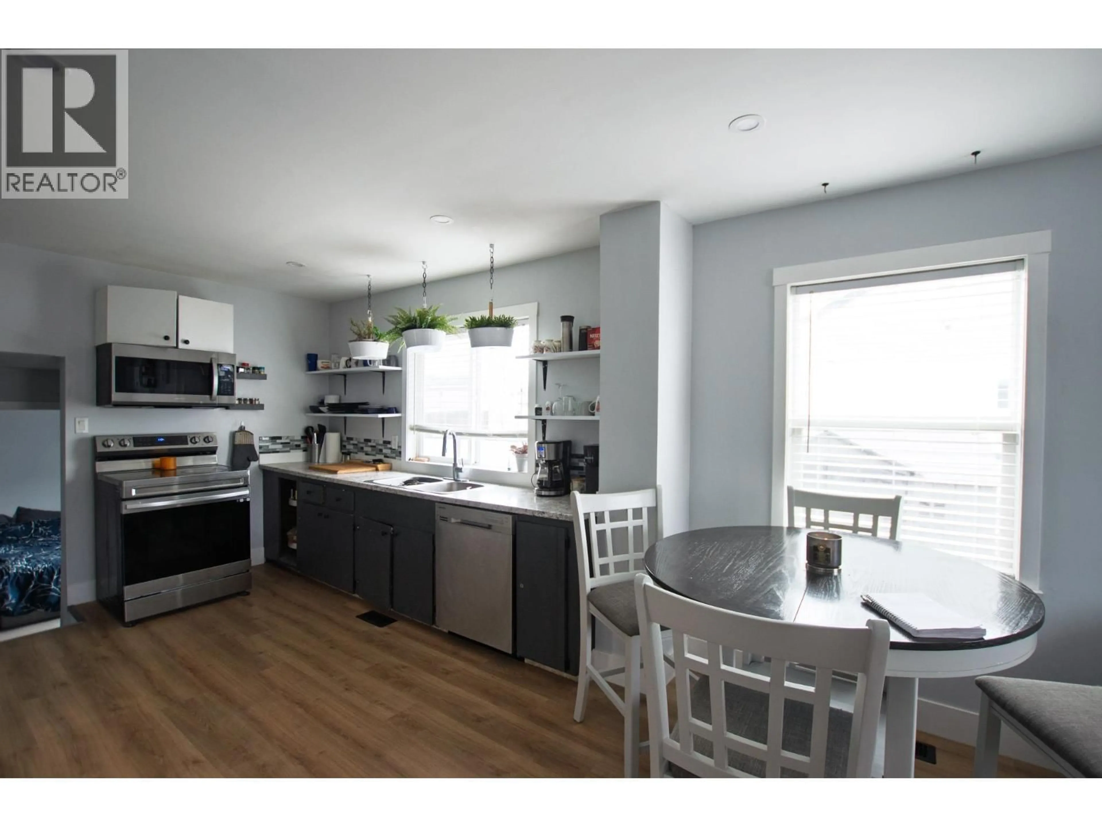 Open concept kitchen, wood/laminate floor for 1904 UPLAND STREET, Prince George British Columbia V2L2V6
