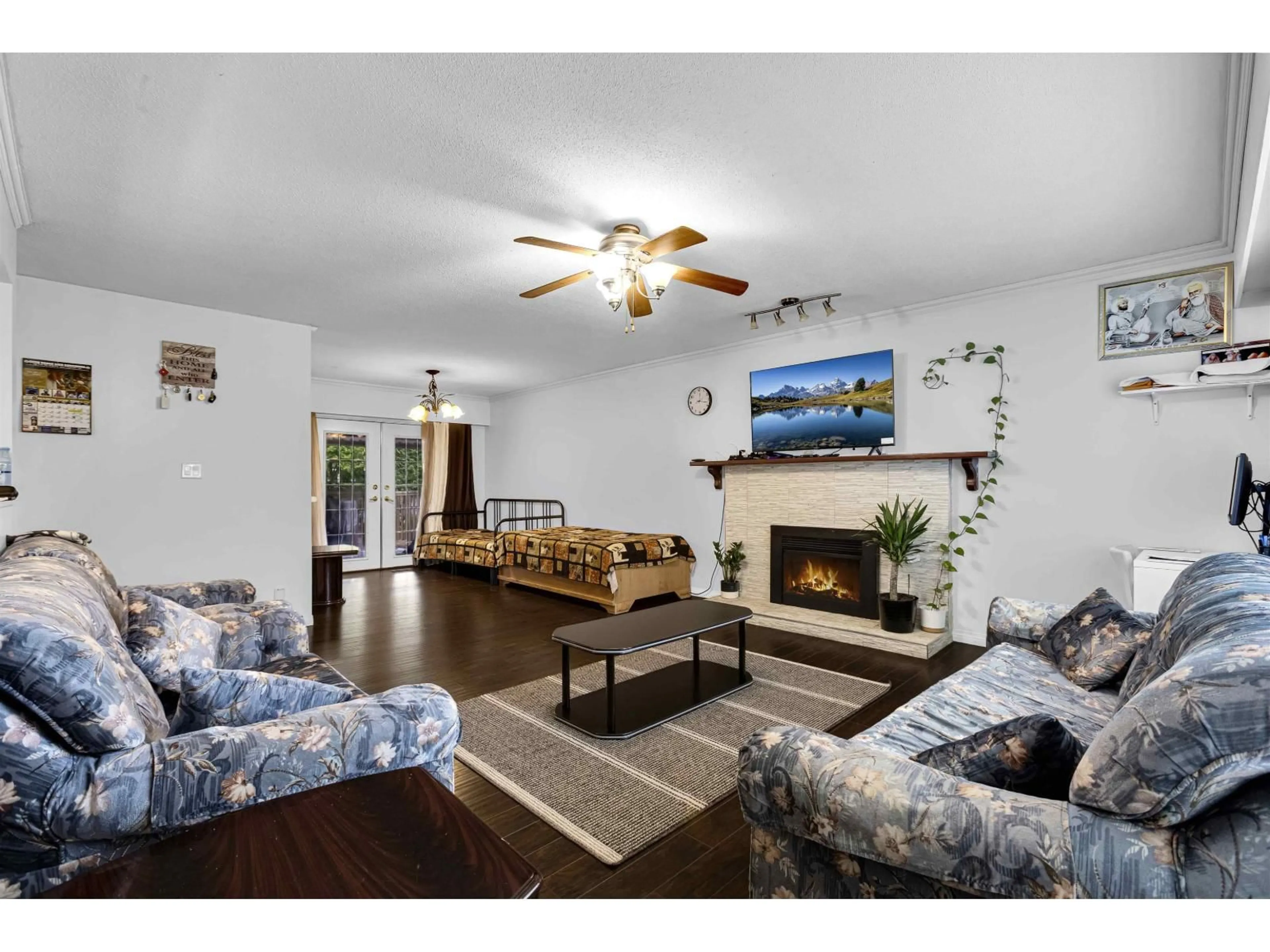 Living room with furniture, wood/laminate floor for 11780 85A AVENUE, Delta British Columbia V4C2V6