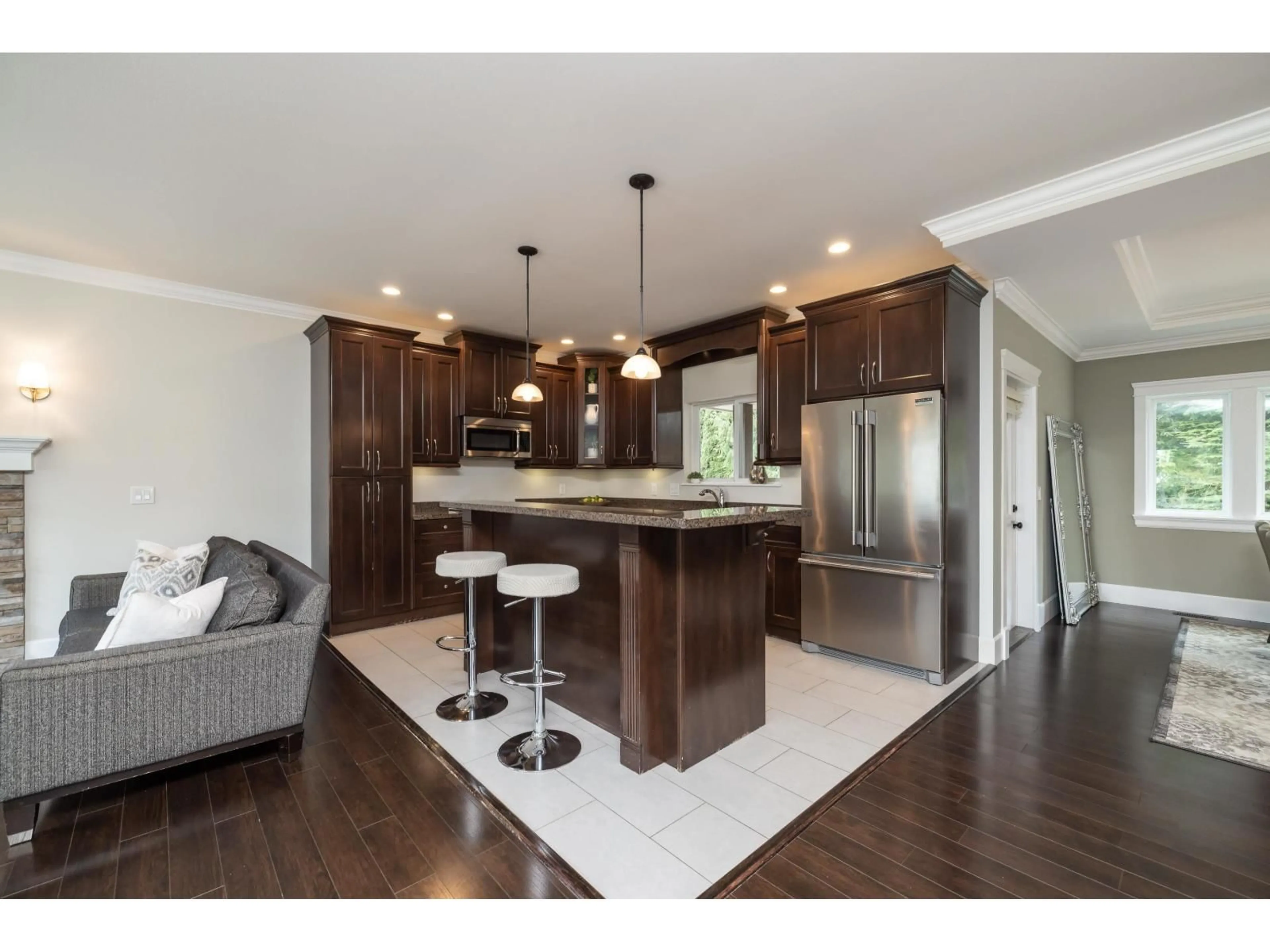 Open concept kitchen, wood/laminate floor for 20294 49A AVENUE, Langley British Columbia V3A3S3