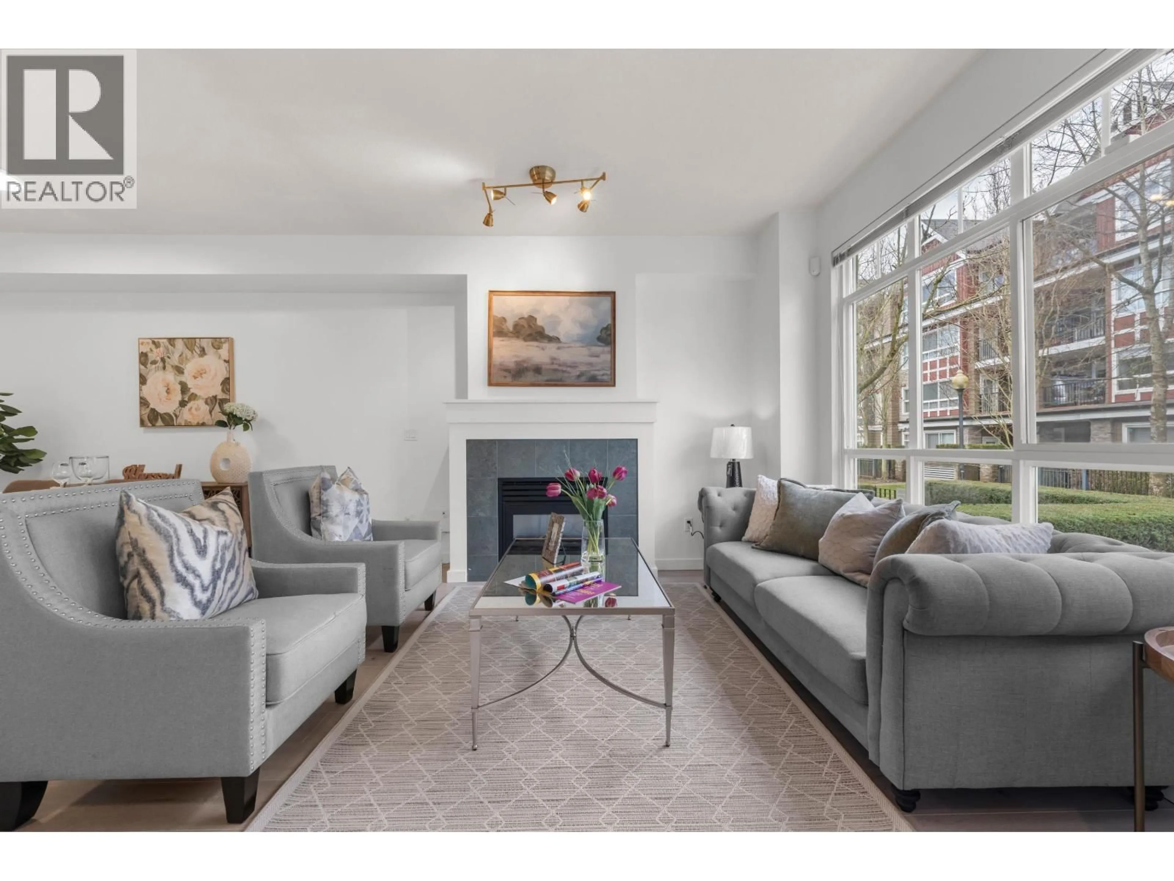 Living room with furniture, unknown for 7148 MONT ROYAL SQUARE, Vancouver British Columbia V5S4X5