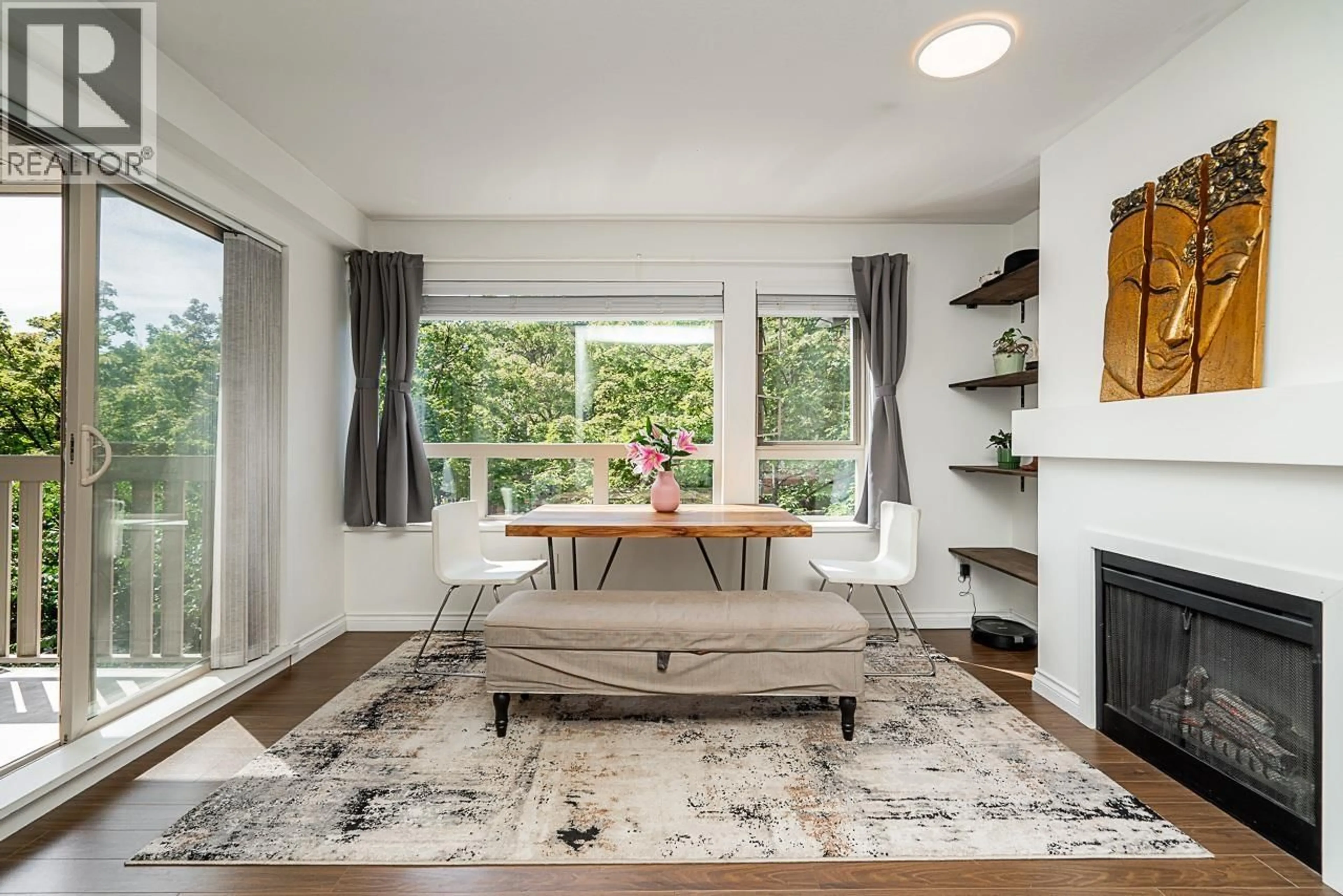 Living room with furniture, wood/laminate floor for 217 - 801 KLAHANIE DRIVE, Port Moody British Columbia V3H5K4