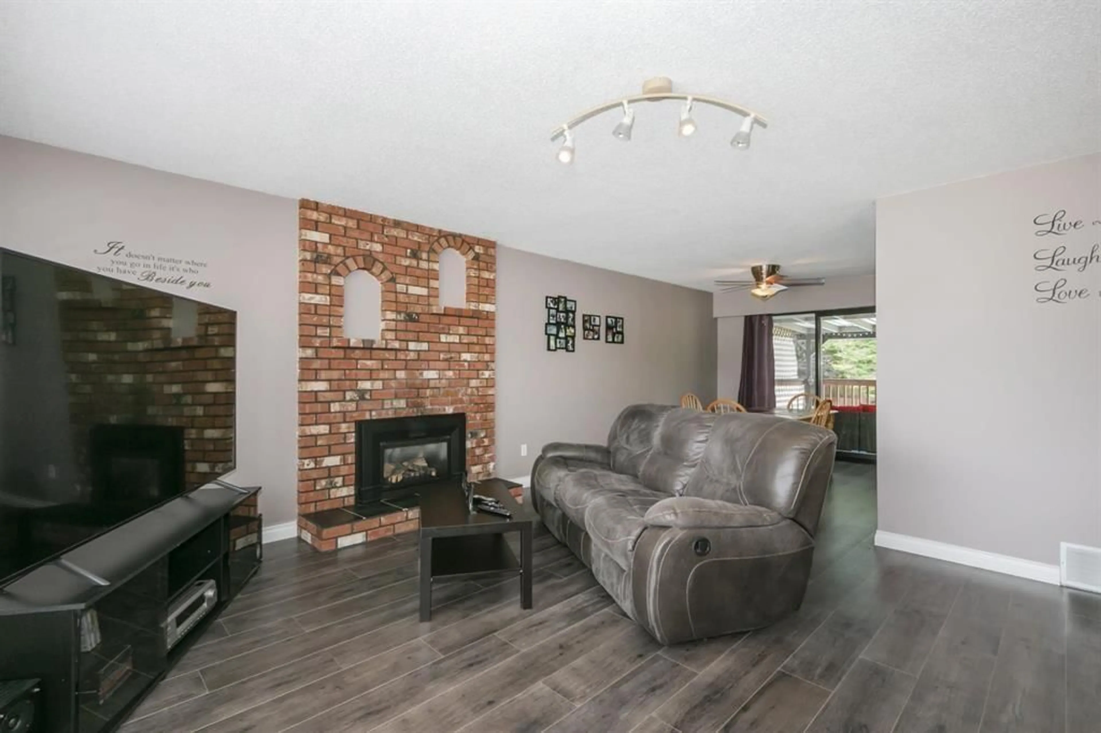 Living room with furniture, wood/laminate floor for 20272 46A AVENUE, Langley British Columbia V3A5K4