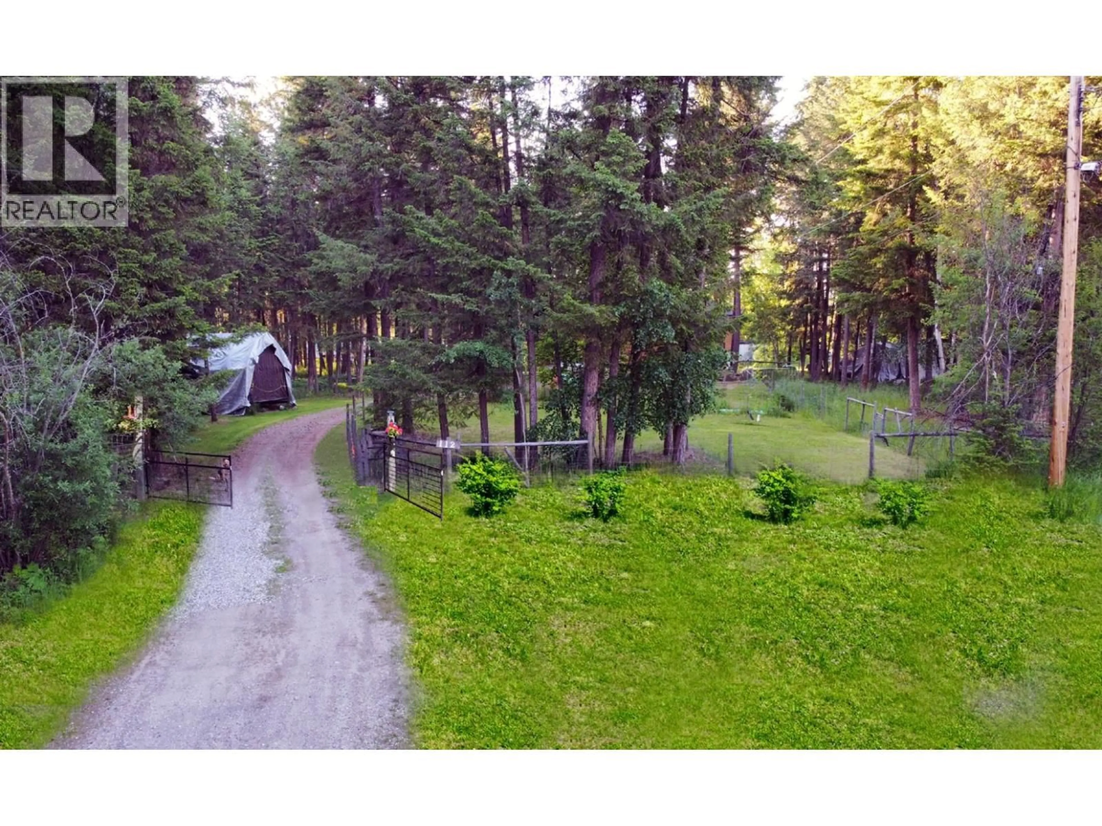 A pic from outside/outdoor area/front of a property/back of a property/a pic from drone, forest/trees view for 112 COREY ROAD, Quesnel British Columbia V2J6J9