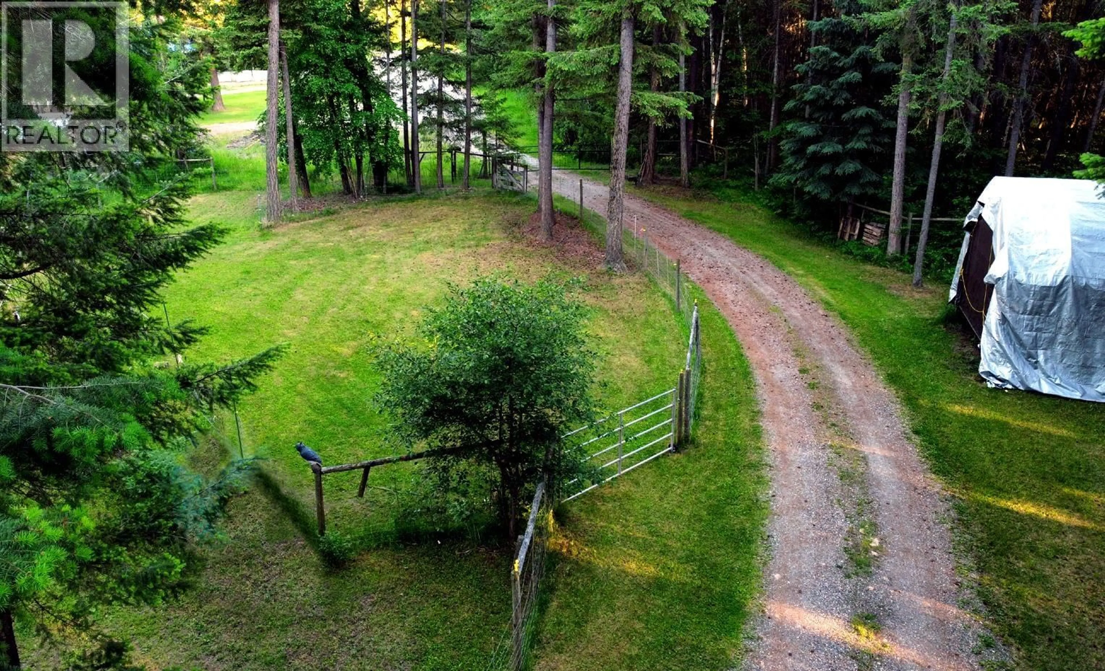 A pic from outside/outdoor area/front of a property/back of a property/a pic from drone, forest/trees view for 112 COREY ROAD, Quesnel British Columbia V2J6J9