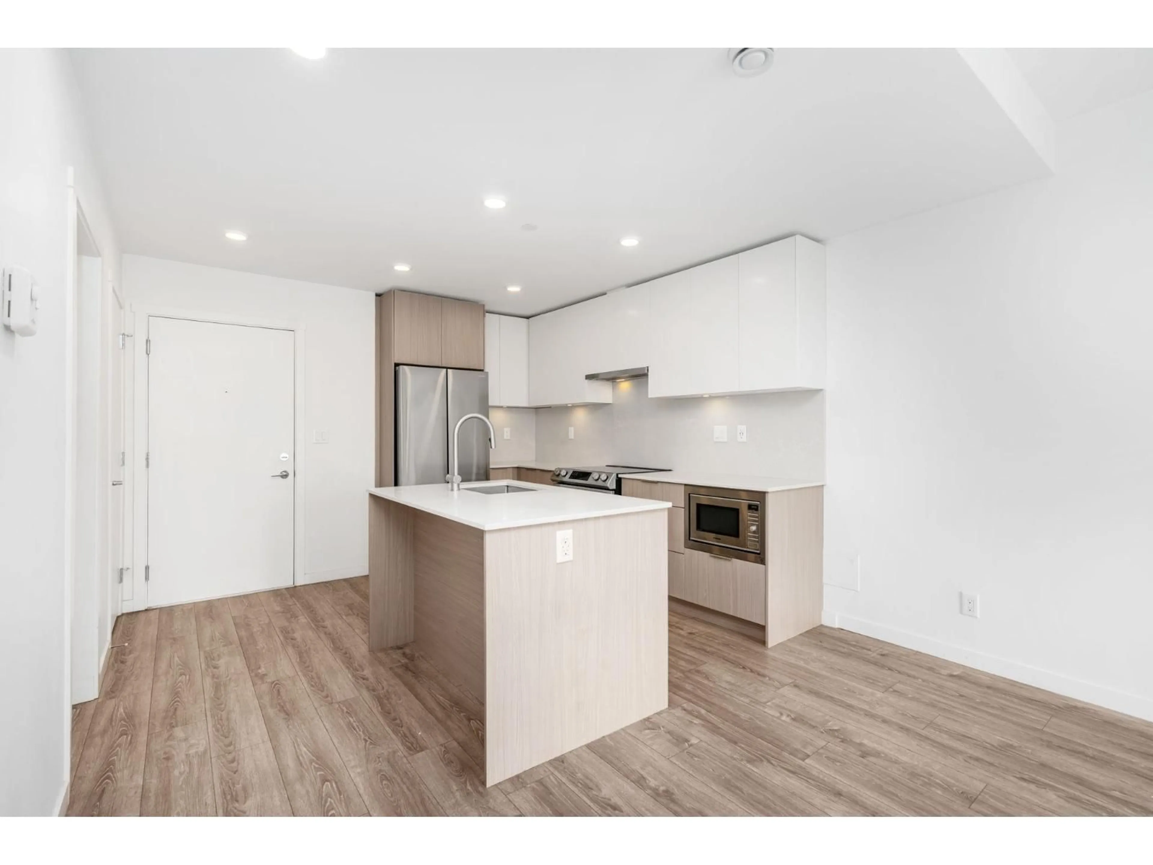 Open concept kitchen, wood/laminate floor for 209 - 13969 96 AVENUE, Surrey British Columbia V3T4M2