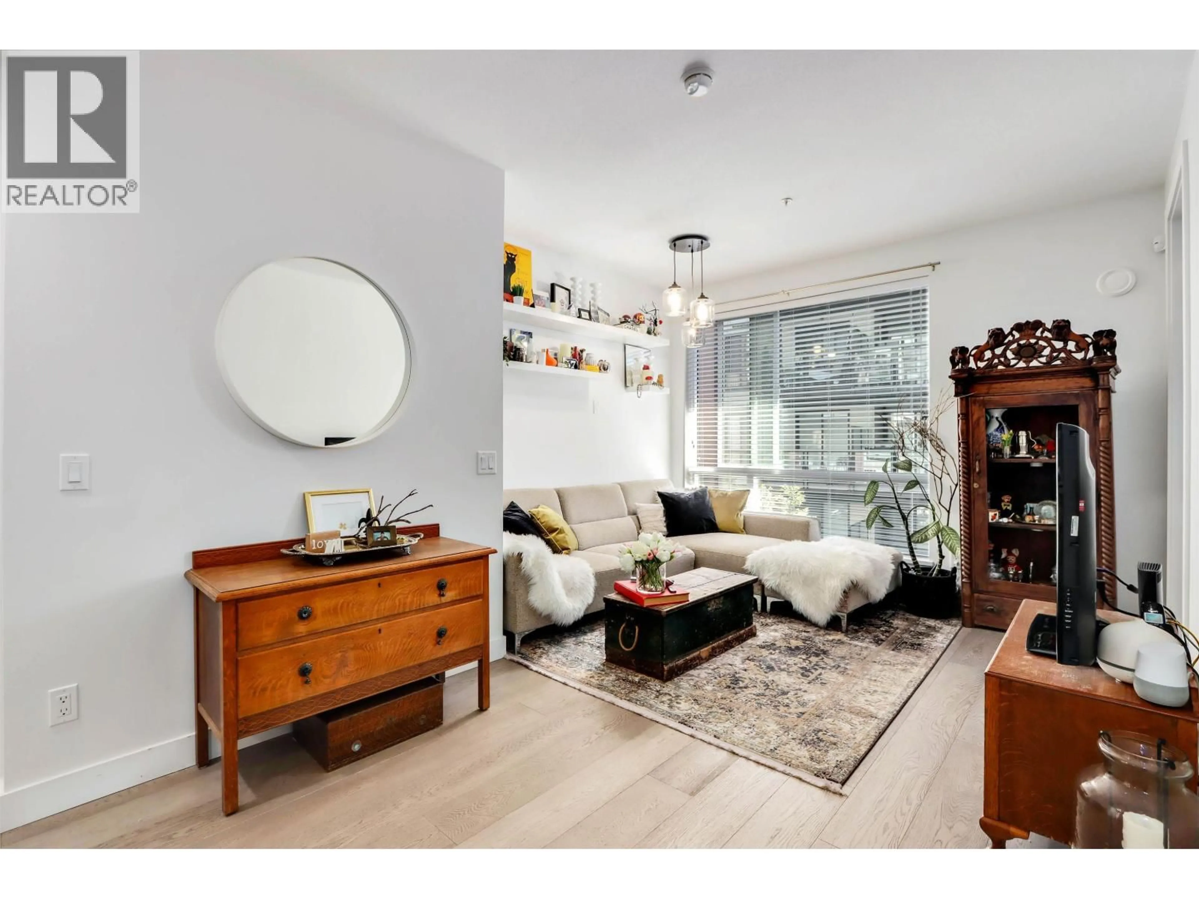 Living room with furniture, wood/laminate floor for 320 - 723 3RD STREET, North Vancouver British Columbia V7M0E4