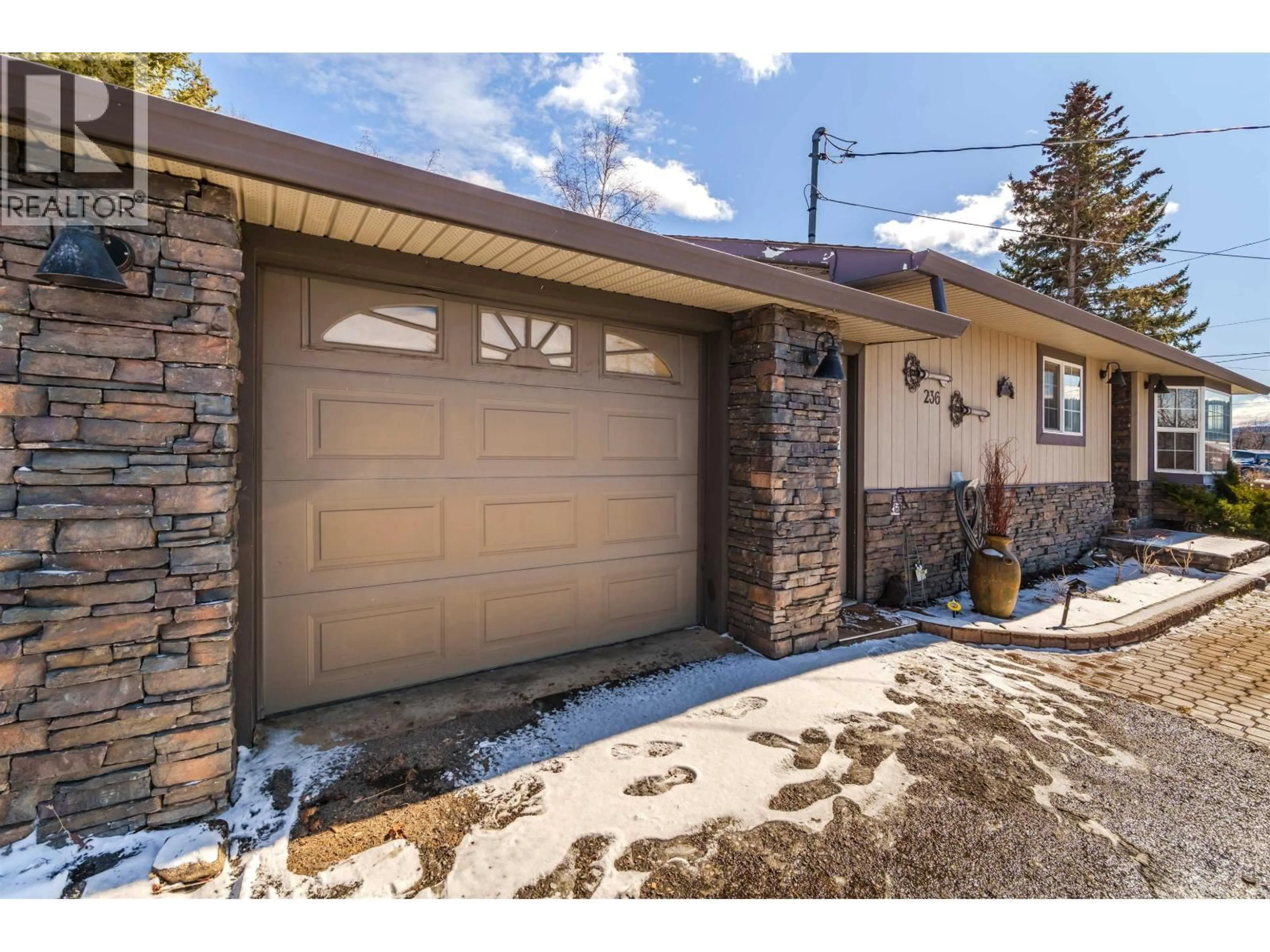 Home with brick exterior material, street for 236 BLACKSTOCK ROAD, 100 Mile House British Columbia V0K2E1